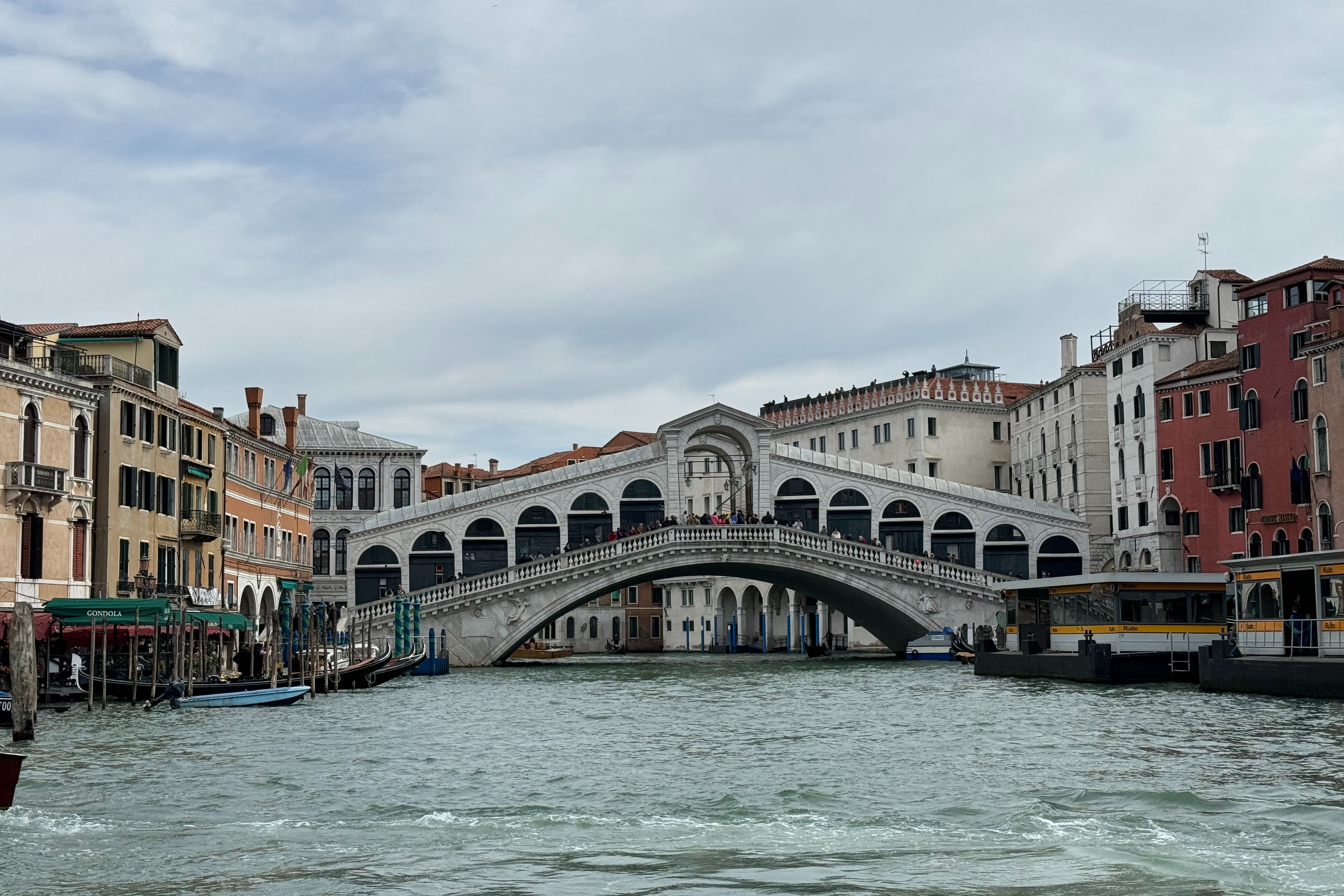 Rialto Bridge is spanning the Grand Canal with architectural grandeur and historical charm.