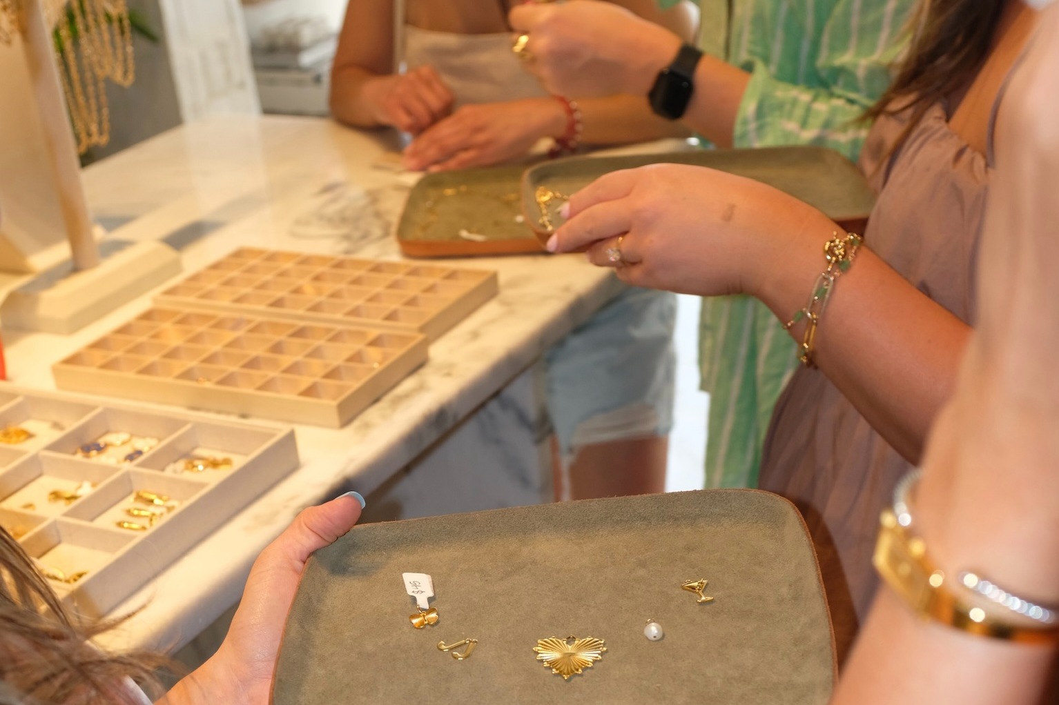 Jewelry charms on a tray