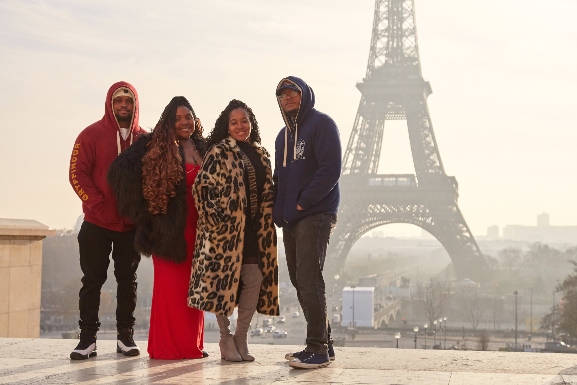 Two men and women picture in front of Eiffel tower.