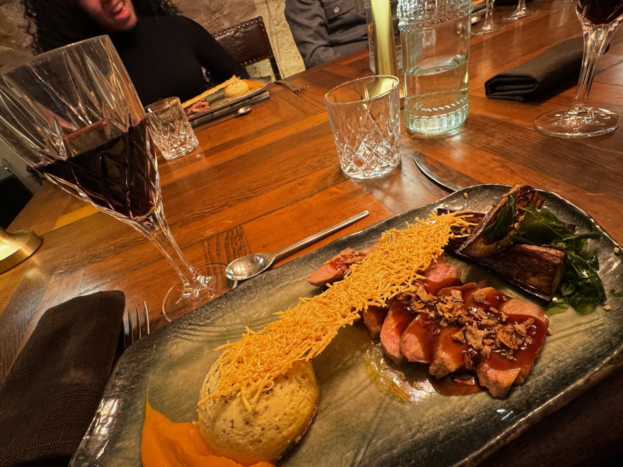 Fancy food and wine on a table.