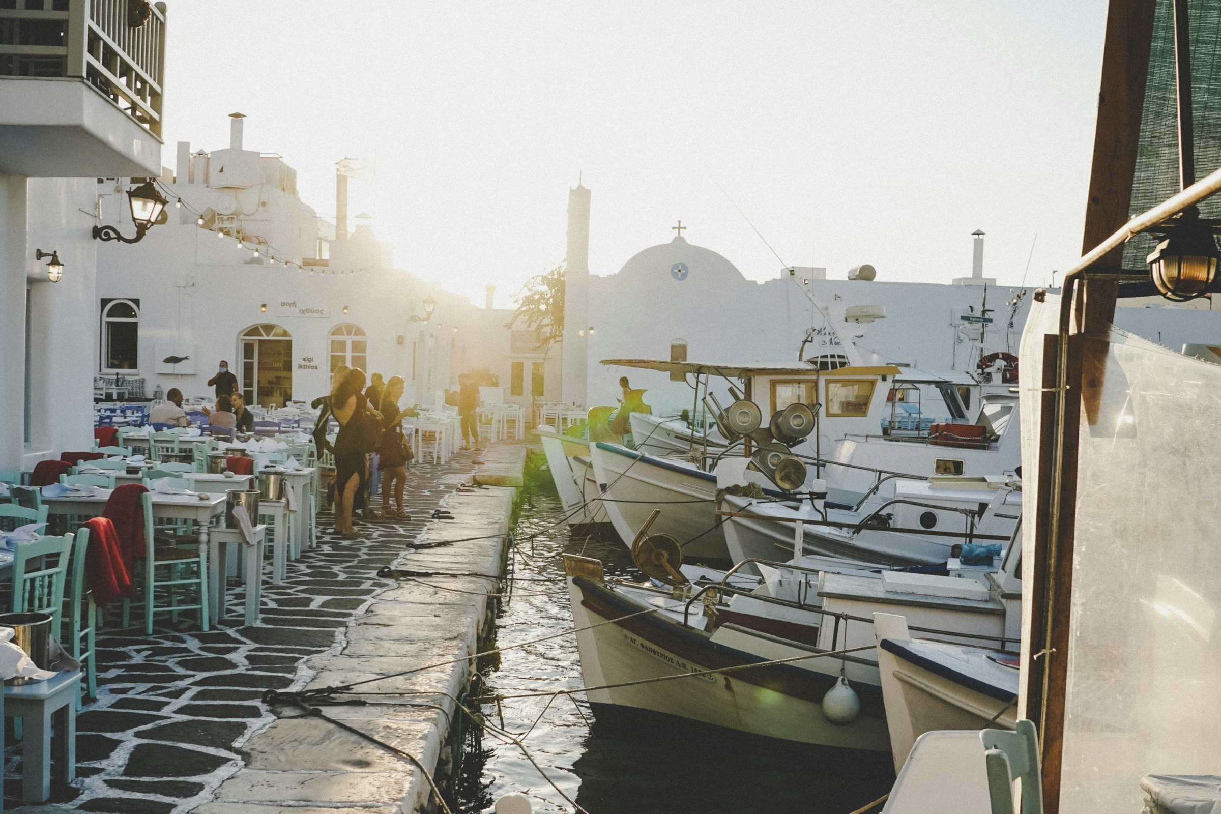 Boats docked beside a restaurant in Parikia, Paros.