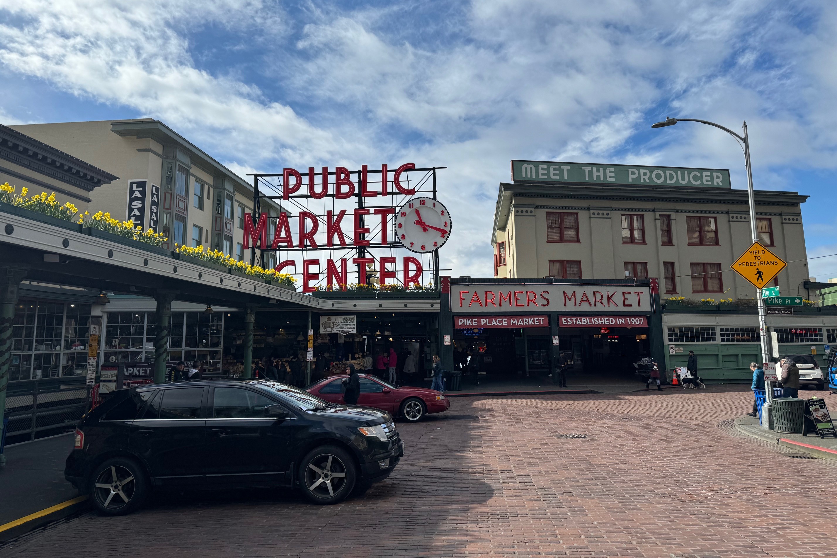 A view of the exterior of Pike Place Market, Seattle's iconic hub of fresh produce, local artisans and vibrant culture.