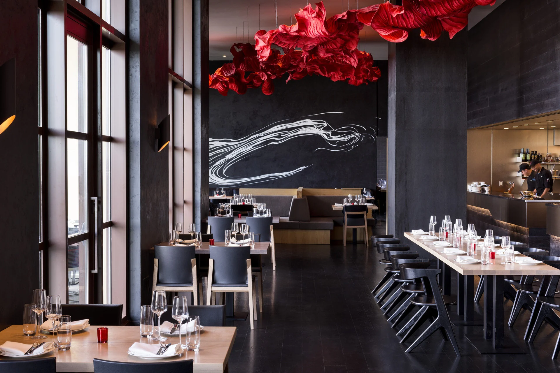 Sleek, contemporary furniture boast a black, red and white color palette at one of Four Seasons Resort Orlando's top dining options