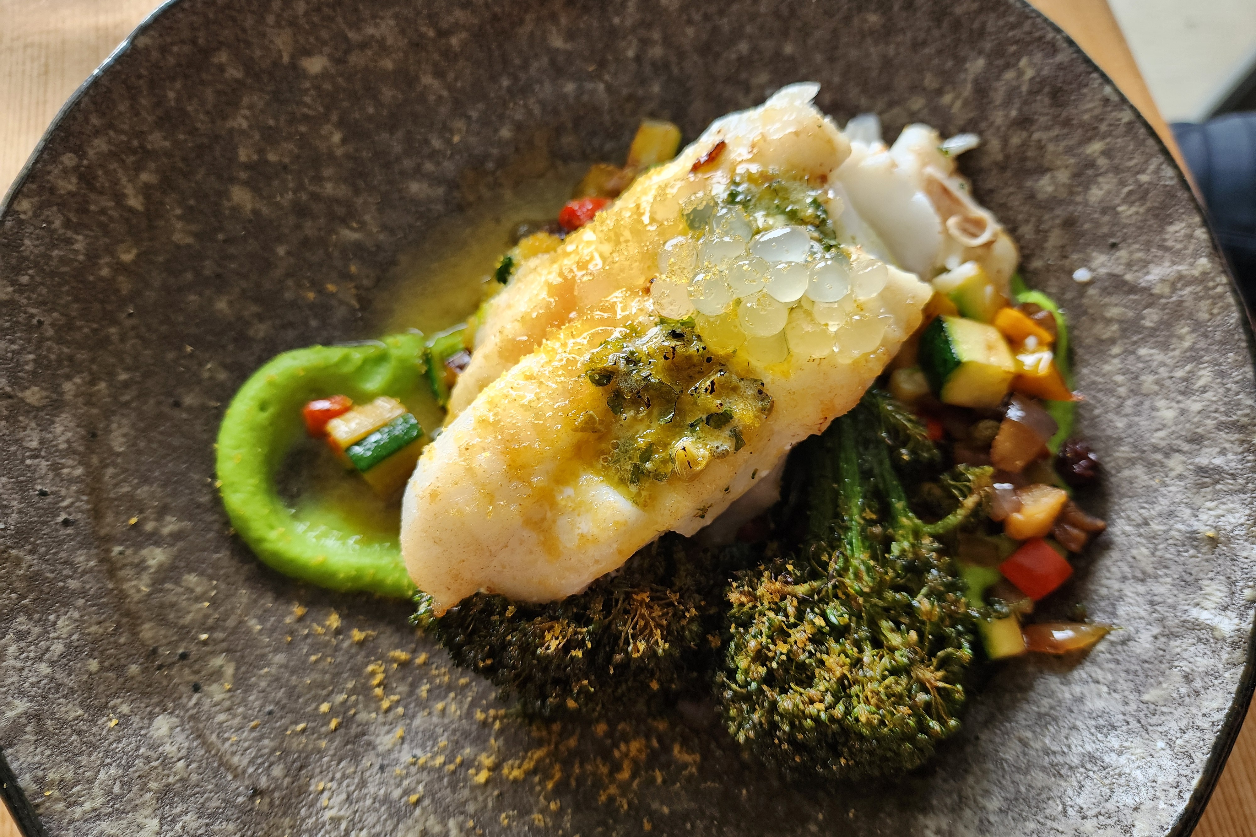 Seafood Lunch at Ghost Rock Winery, with an elegant stone plate of fish and vegetables