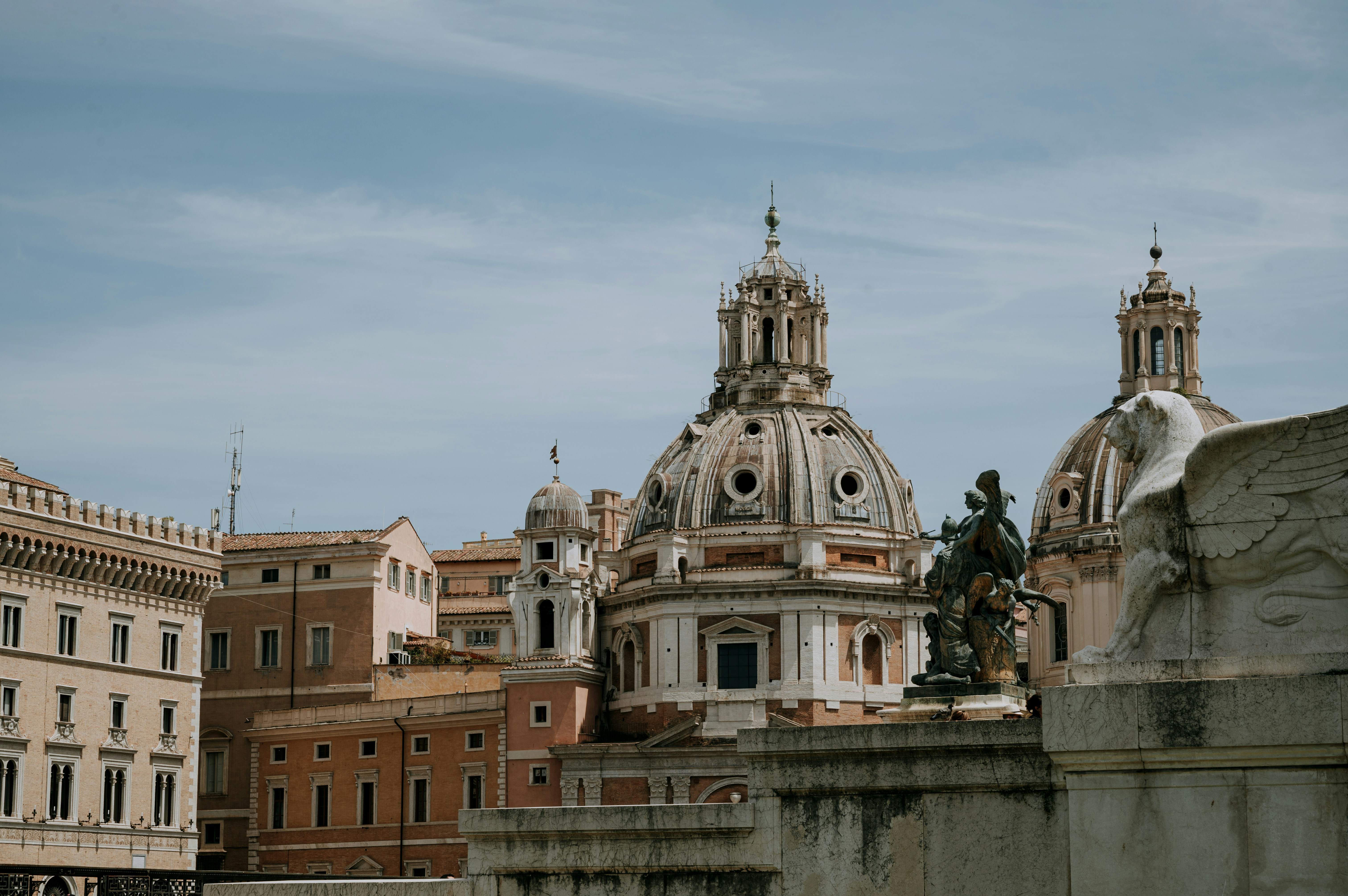 A picture of buildings with Roman architecture taken during the daytime.