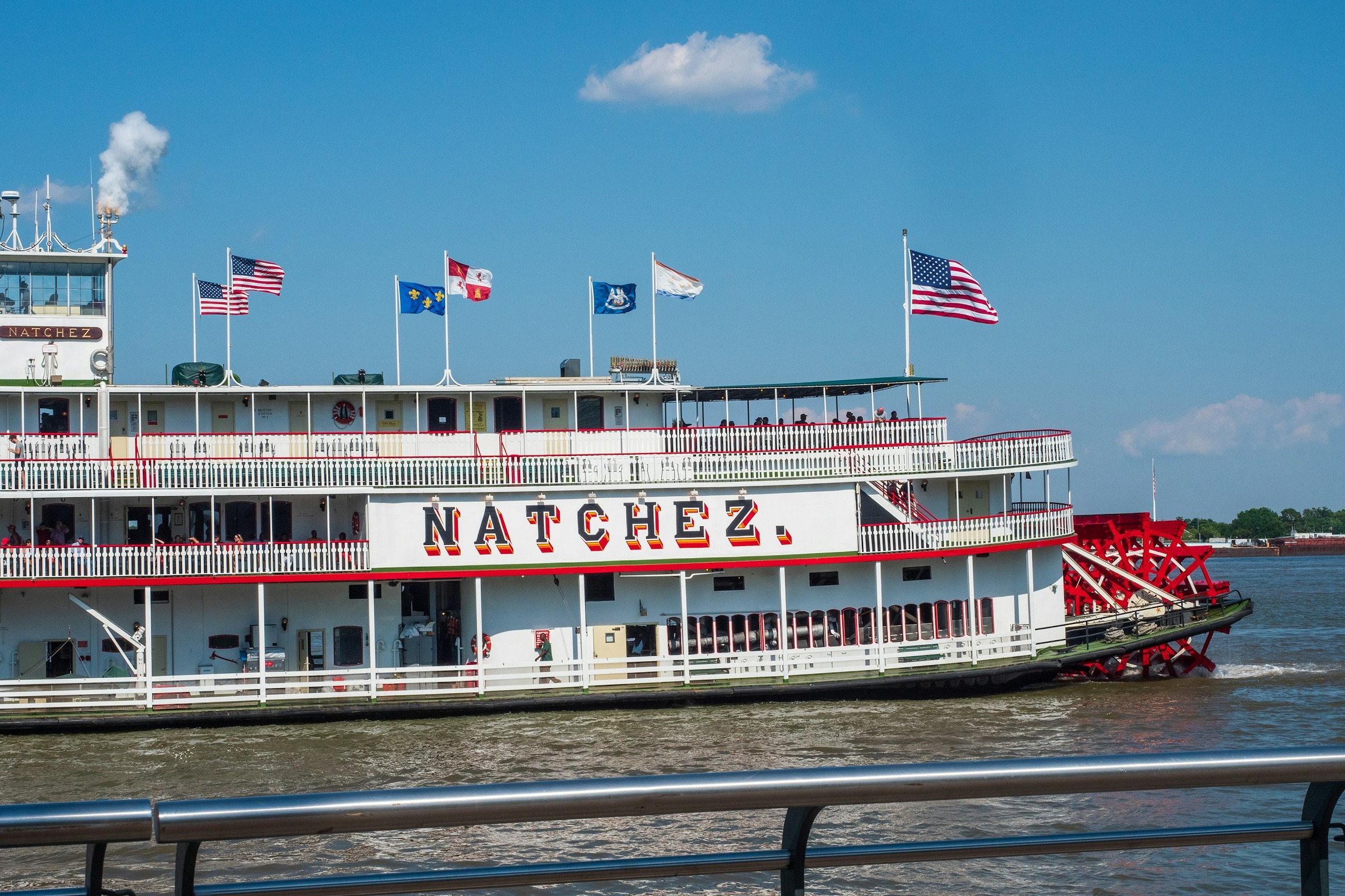 Natchez steamboat sailing on Mississippi River at daytime.