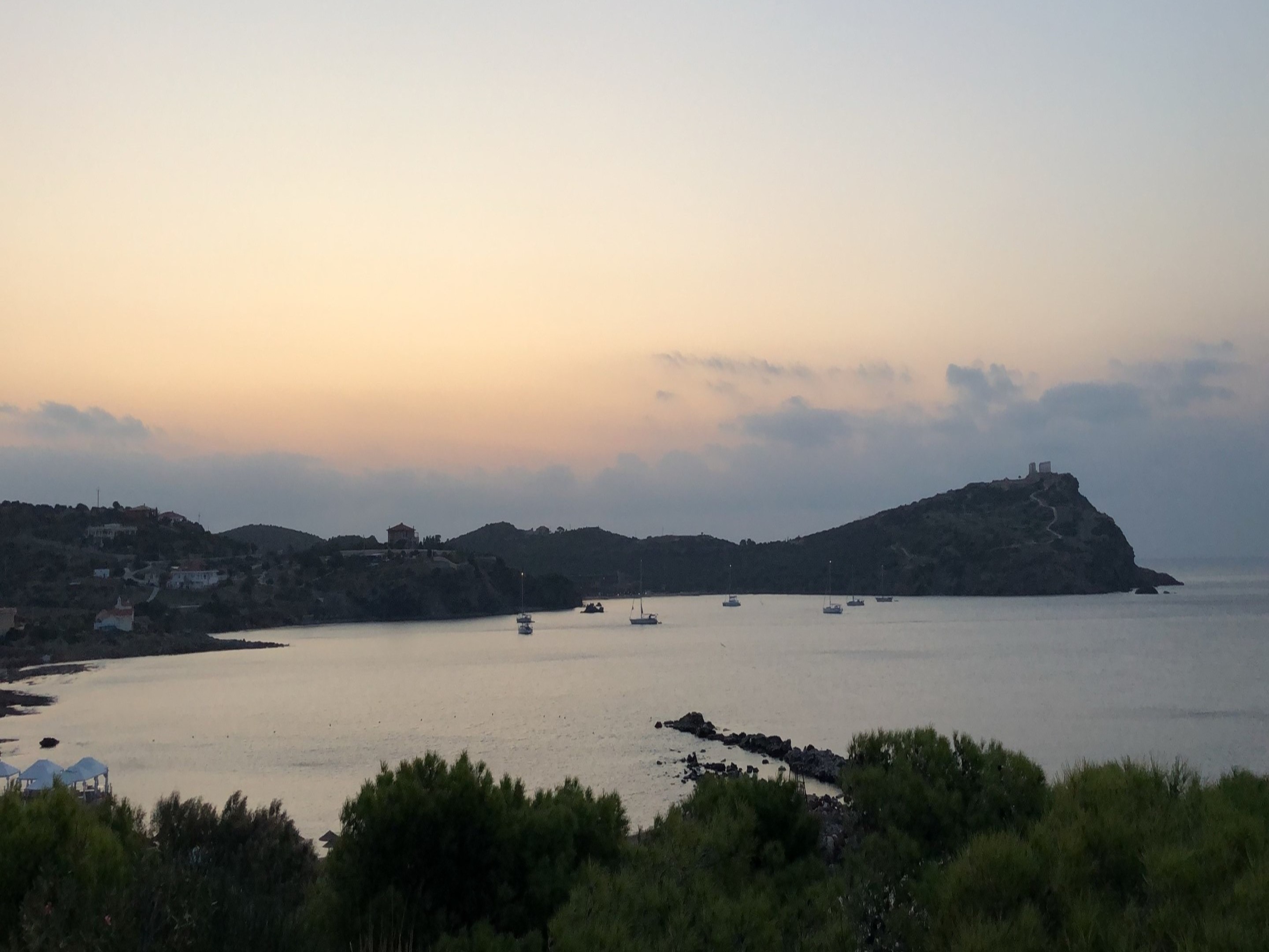 An aerial view of the water surrounded by the Island during sunrise.
