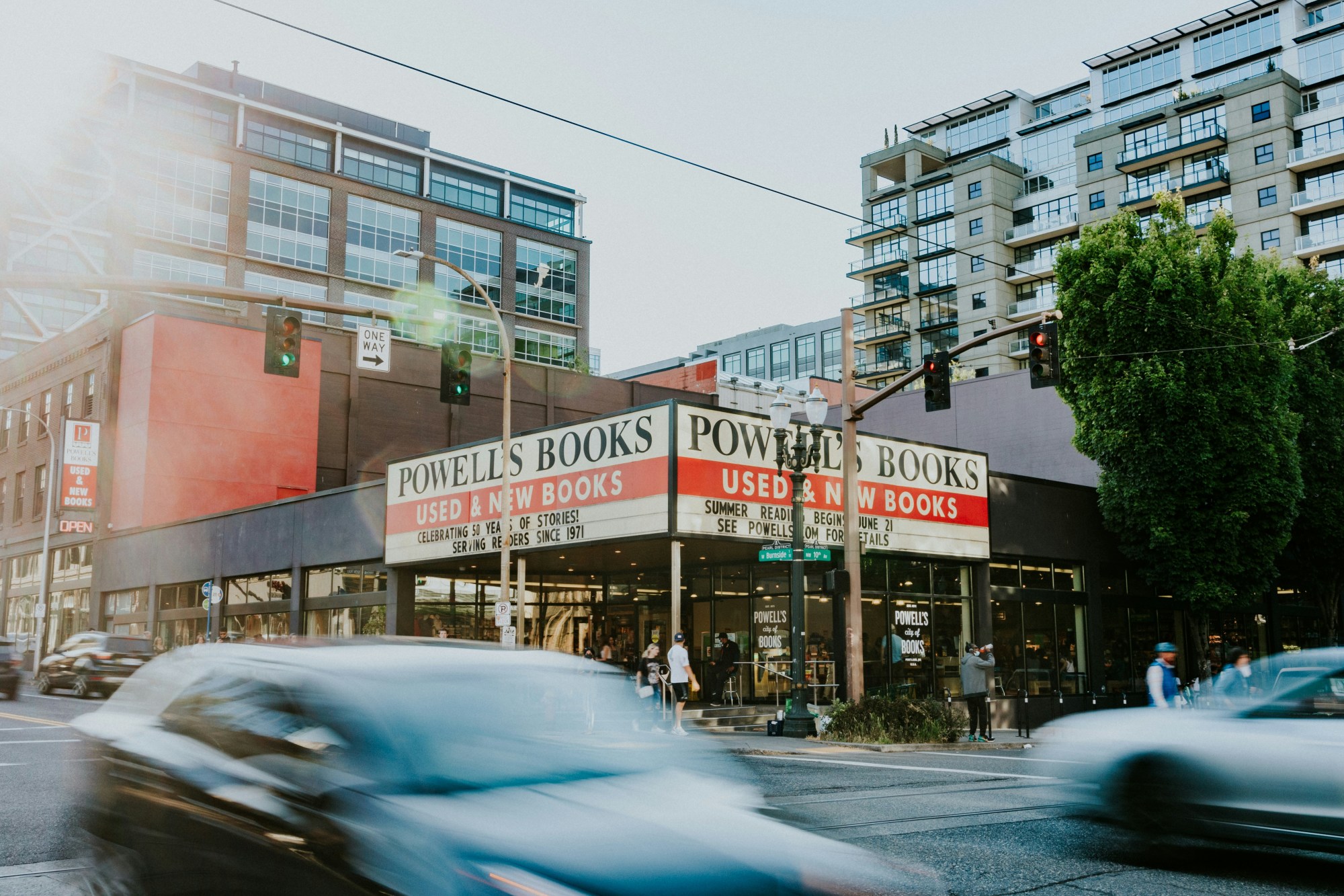 a marquee on a squat urban building reads "Powell's Books."