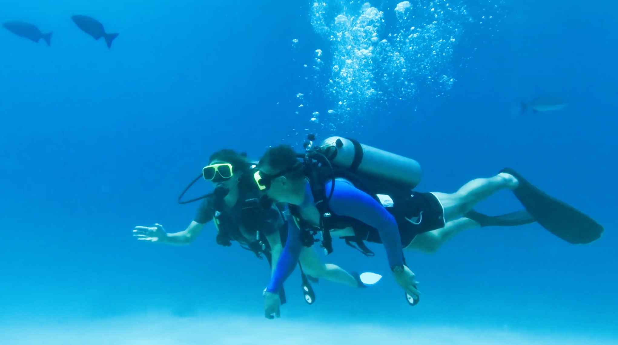 Scuba diving in the sea with partner