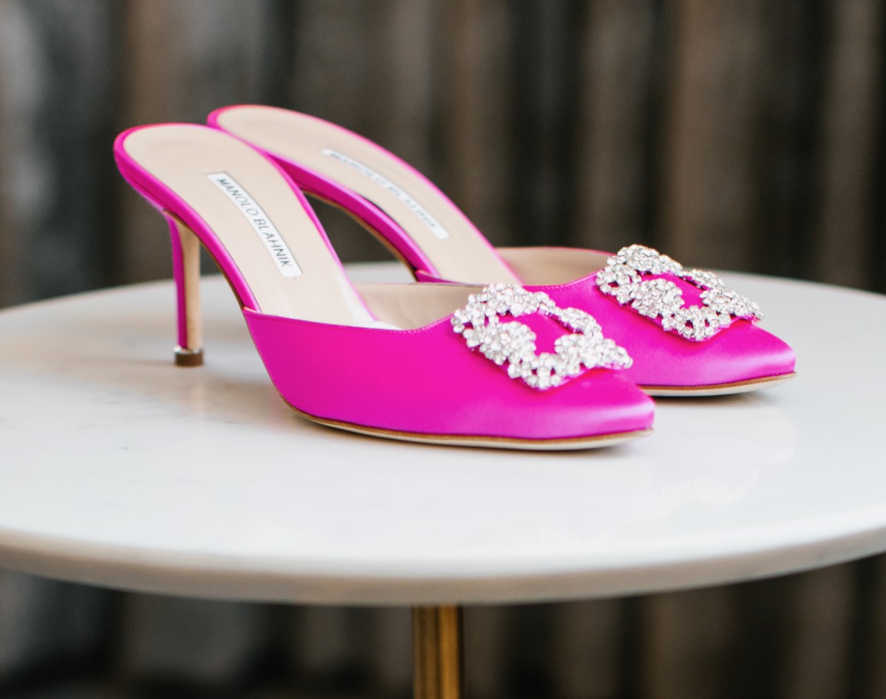 A pair of pink heeled shoes