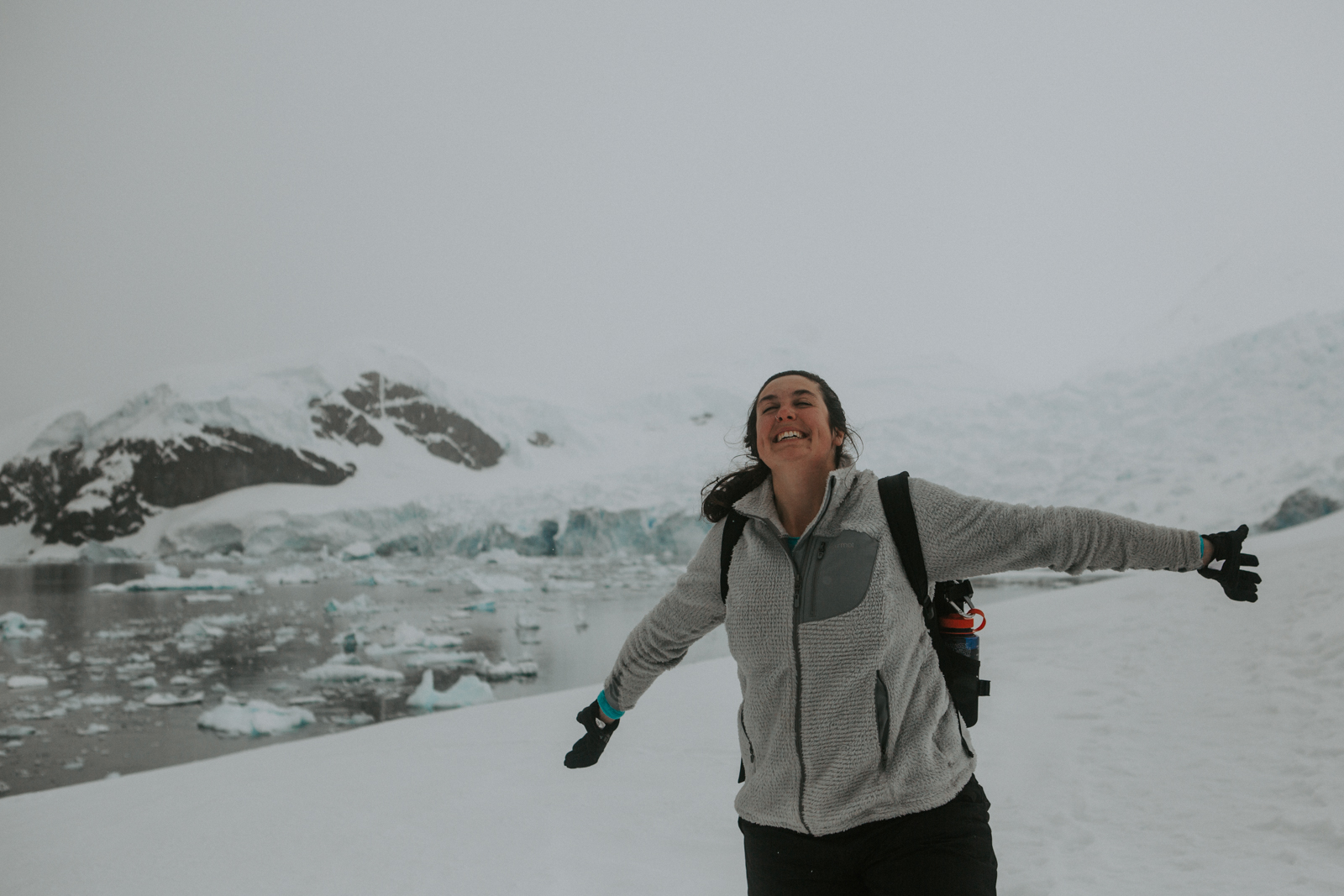 Travel advisor Rachel posing for a picture in icy landscape in Antarctica