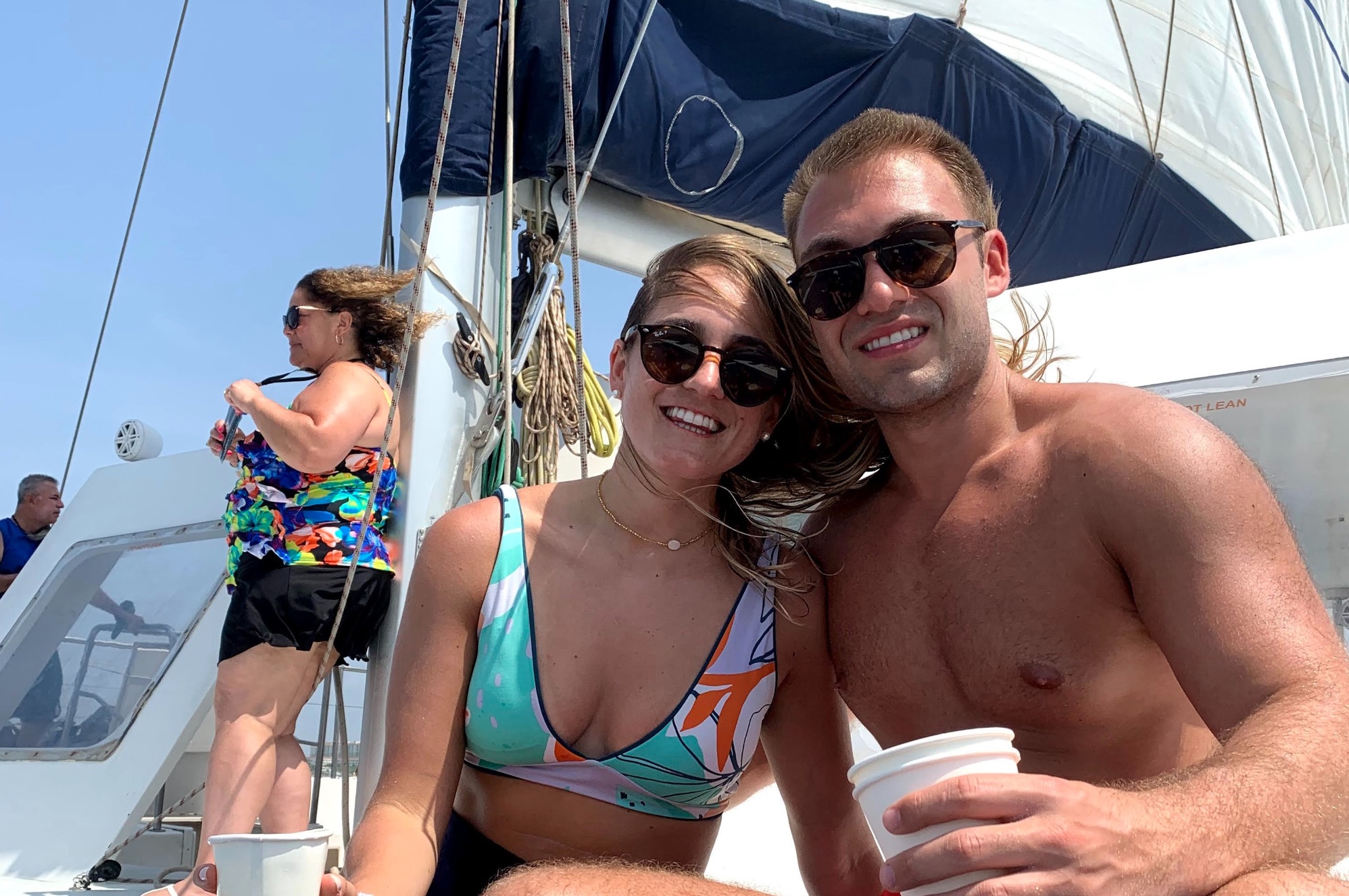 A couple sailing on a sunset cruise along the coast of Aruba.