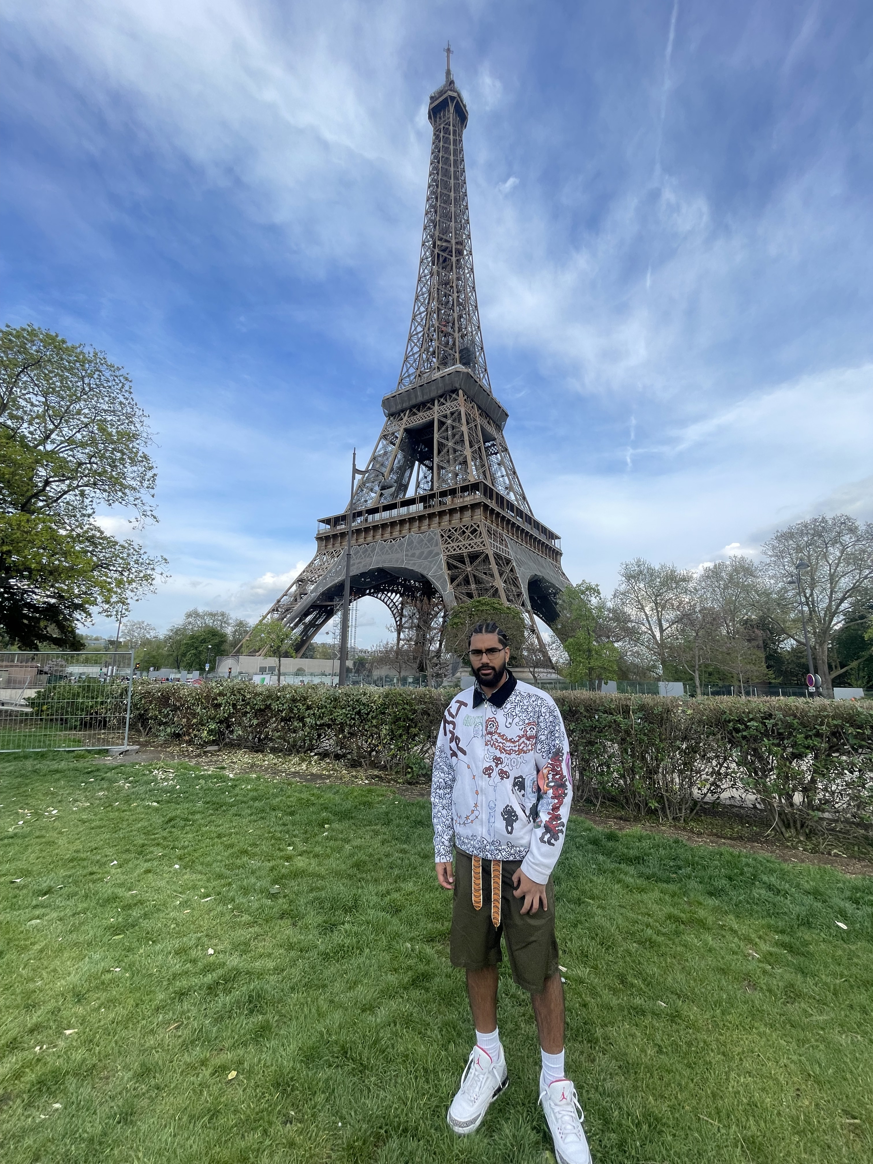Travel advisor Matthew standing on grass with the Eiffel Tower in view