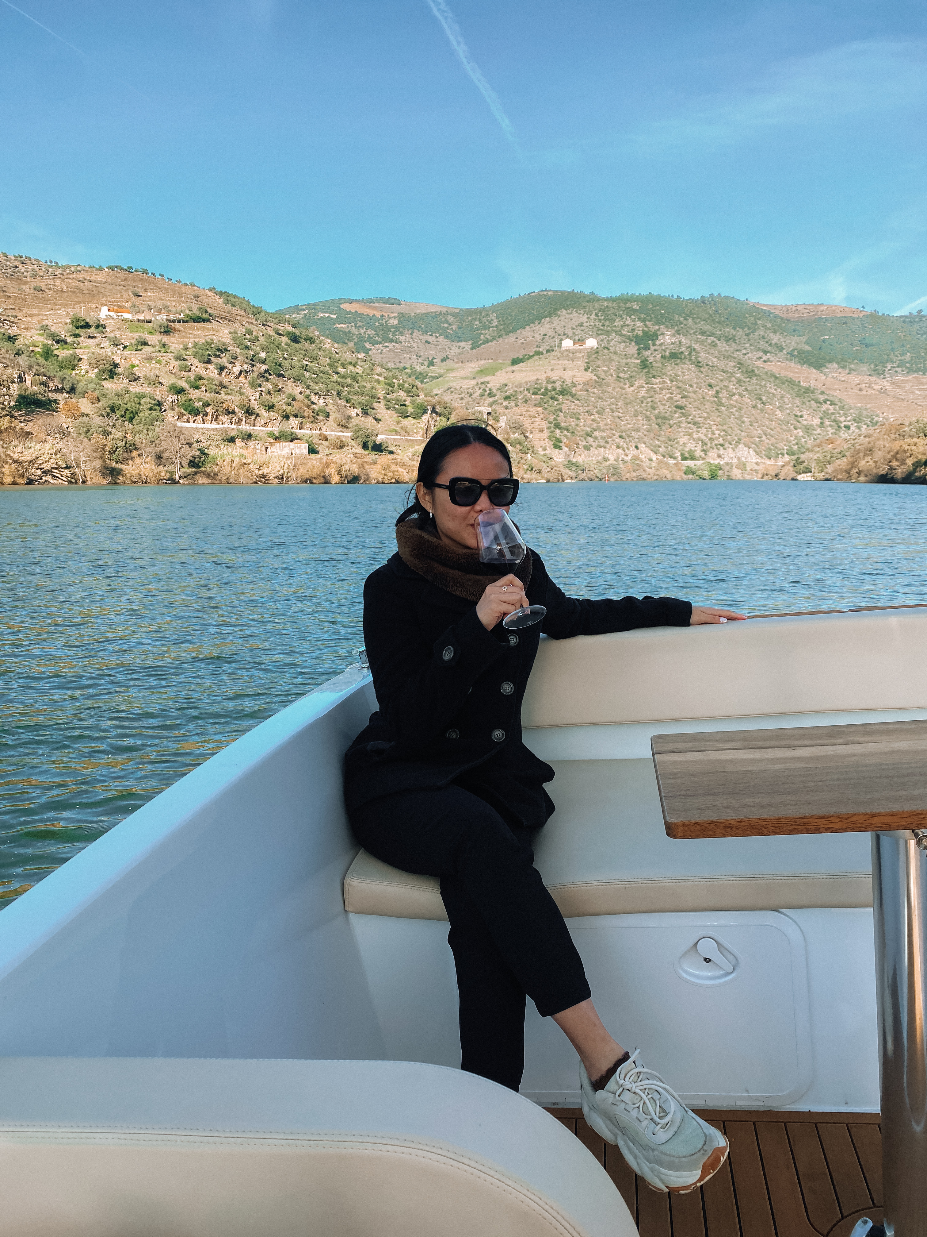 Picture of Candy in boat having a drink