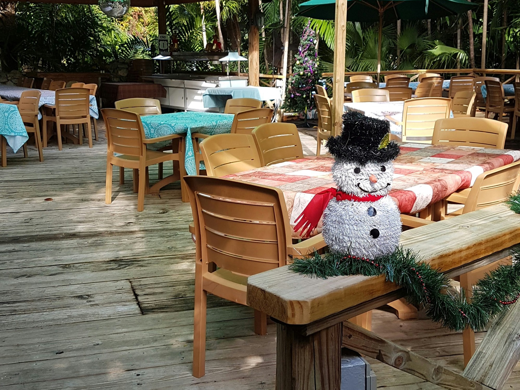 Patio of a restaurant with tables and chairs.