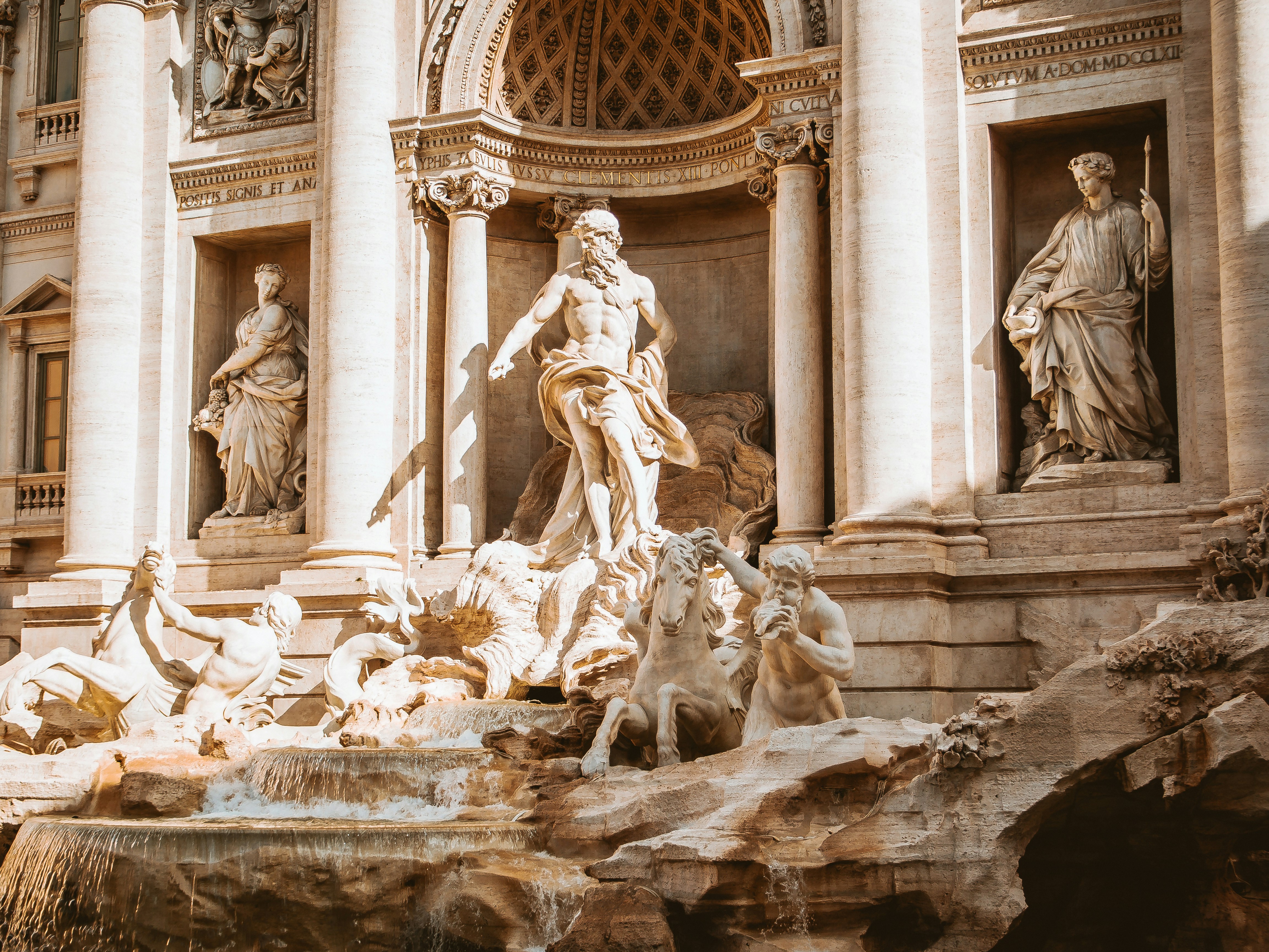 A picture of a monument of human and horse statues