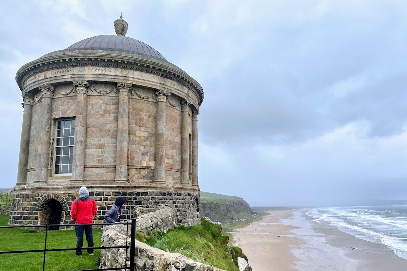 A round structure next to the beach