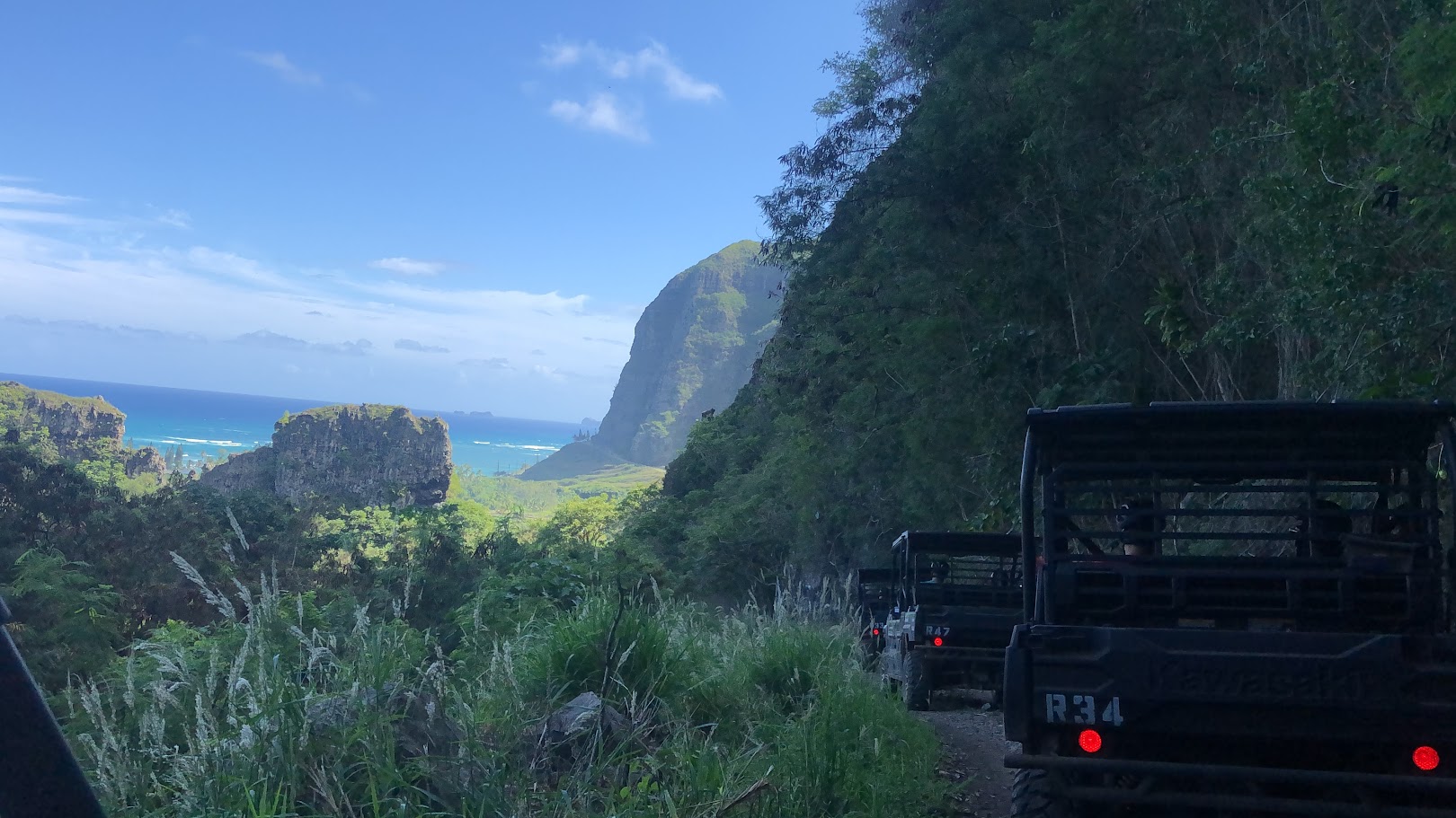 Cars on a road on the side of a mountain