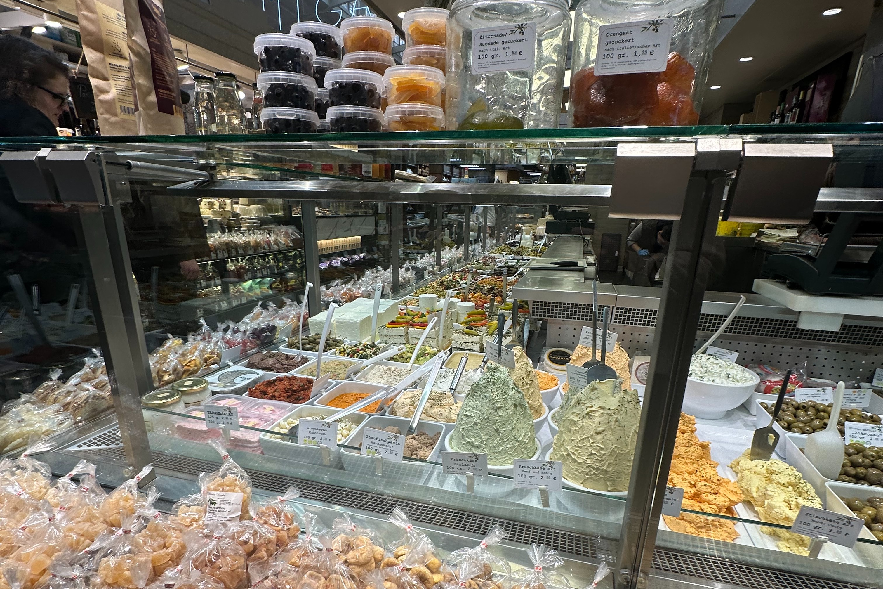 A deli counter with bowls of food