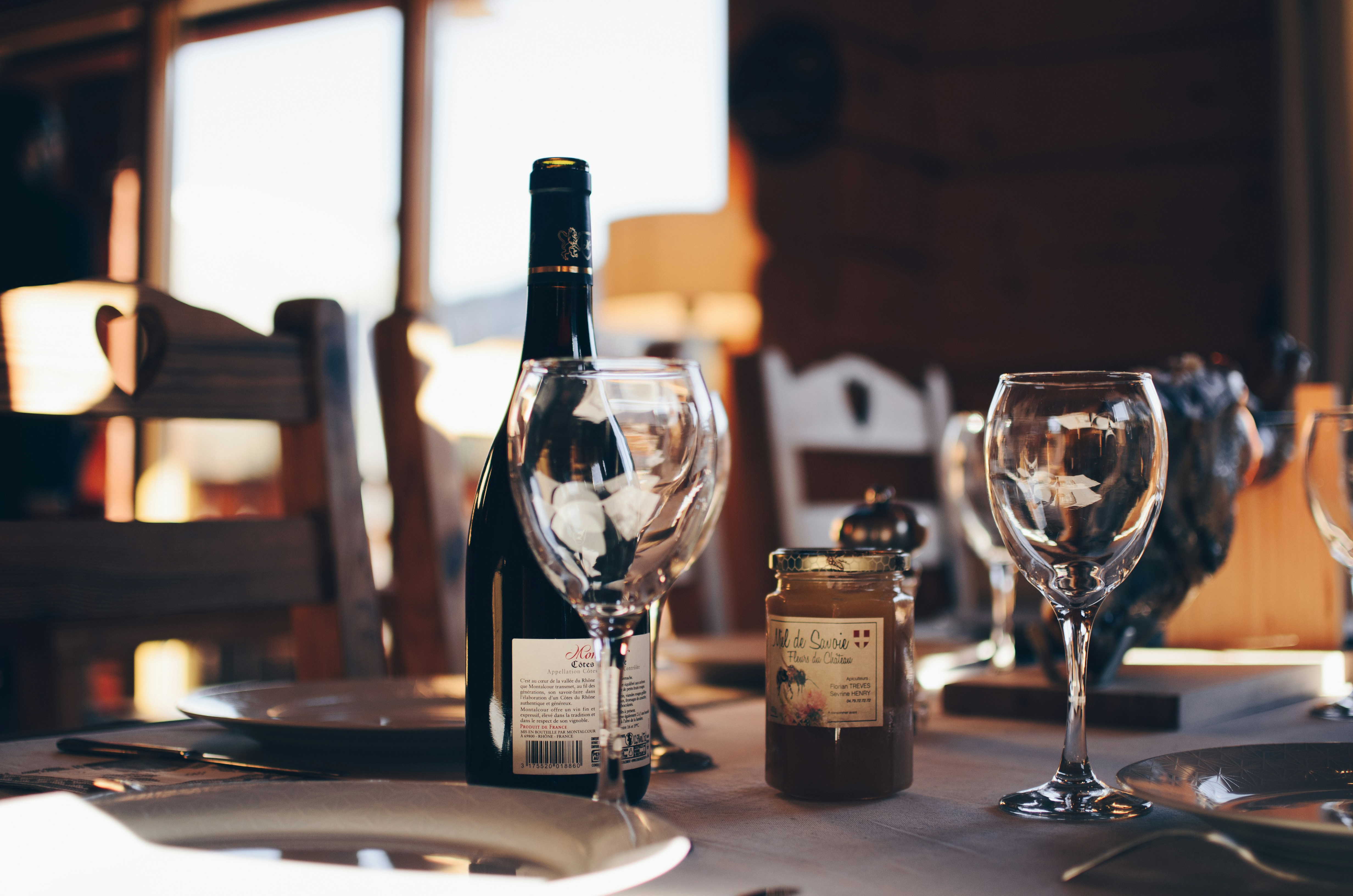 Closeup photo of two empty wine glasses on a table.