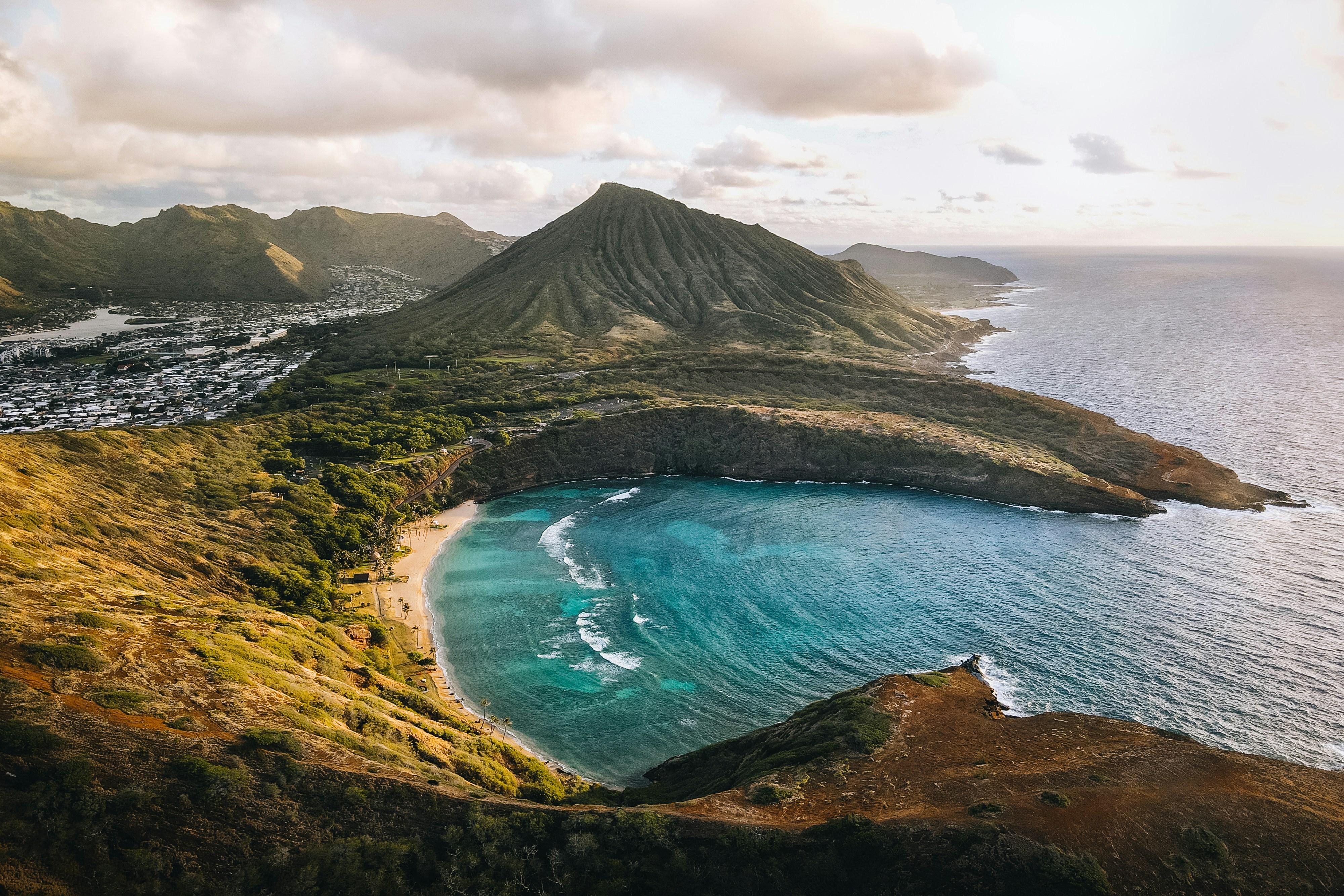 An aerial view of the island near the sea shore during the daytime.