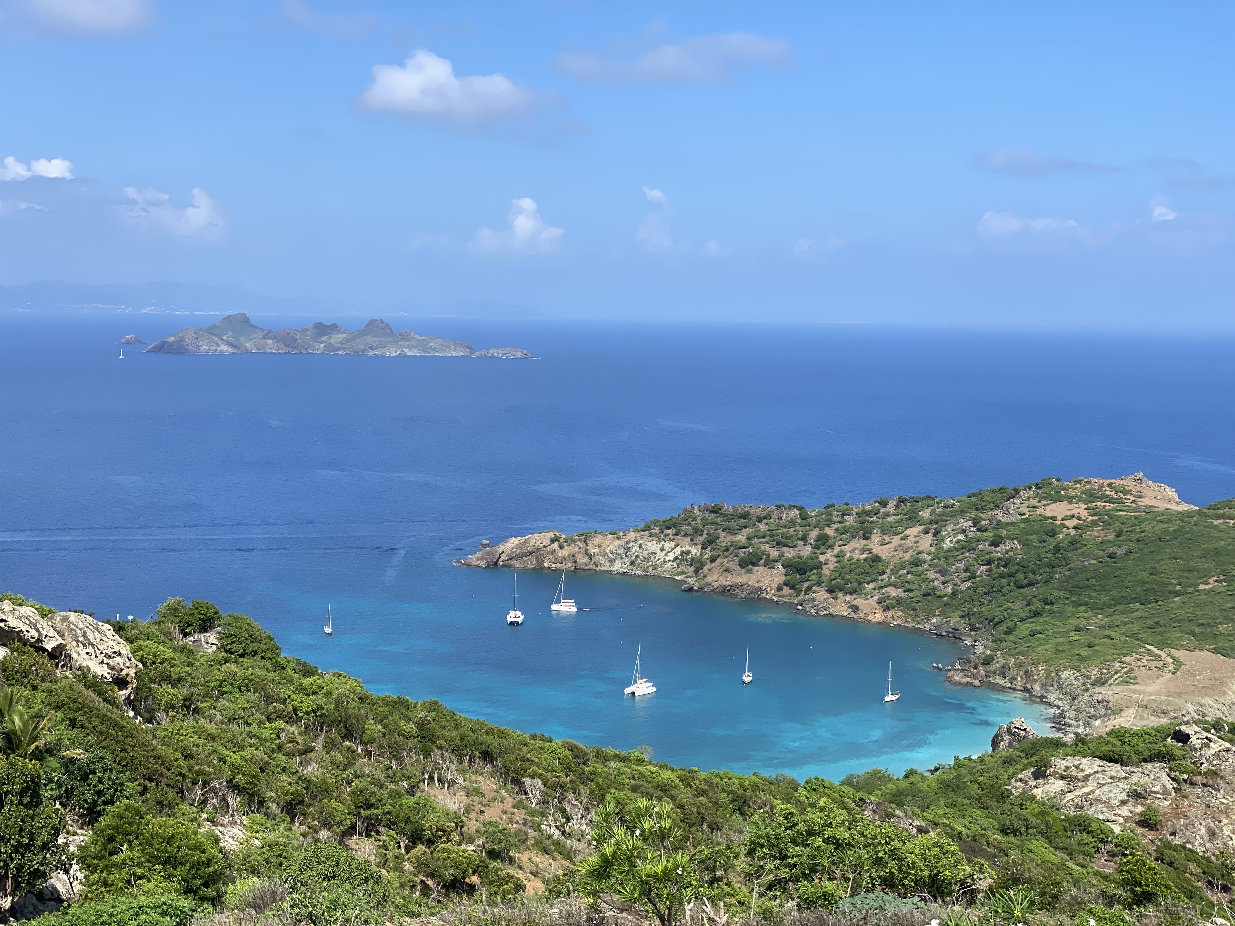 Aerial view of an island and the ocean during the daytime