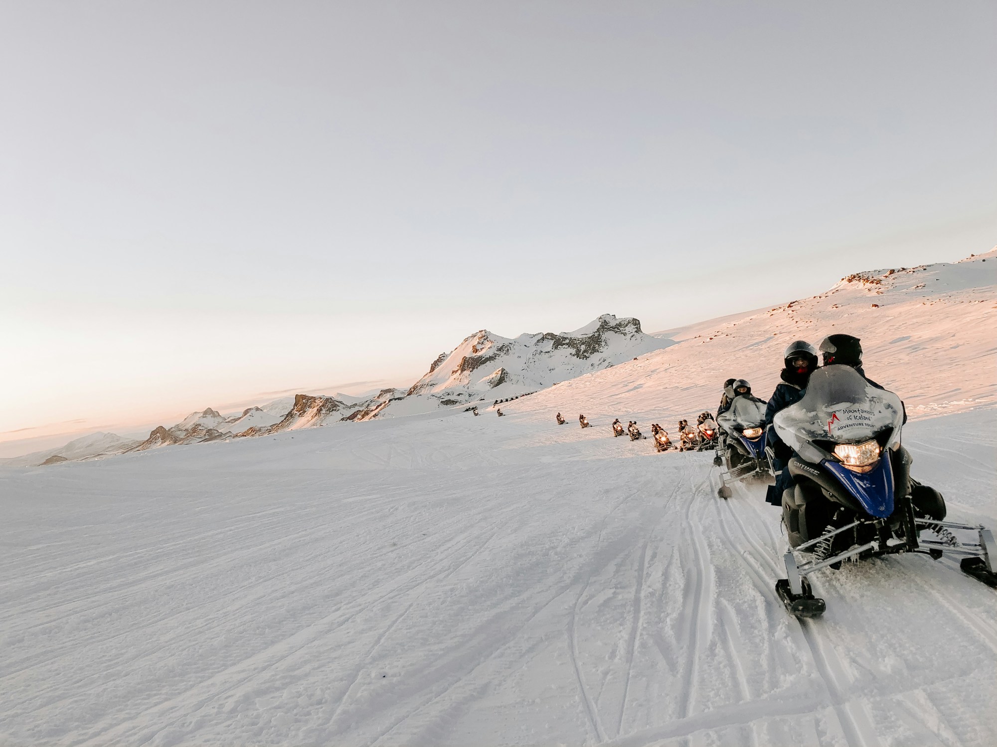 Snowmobiling during daytime.