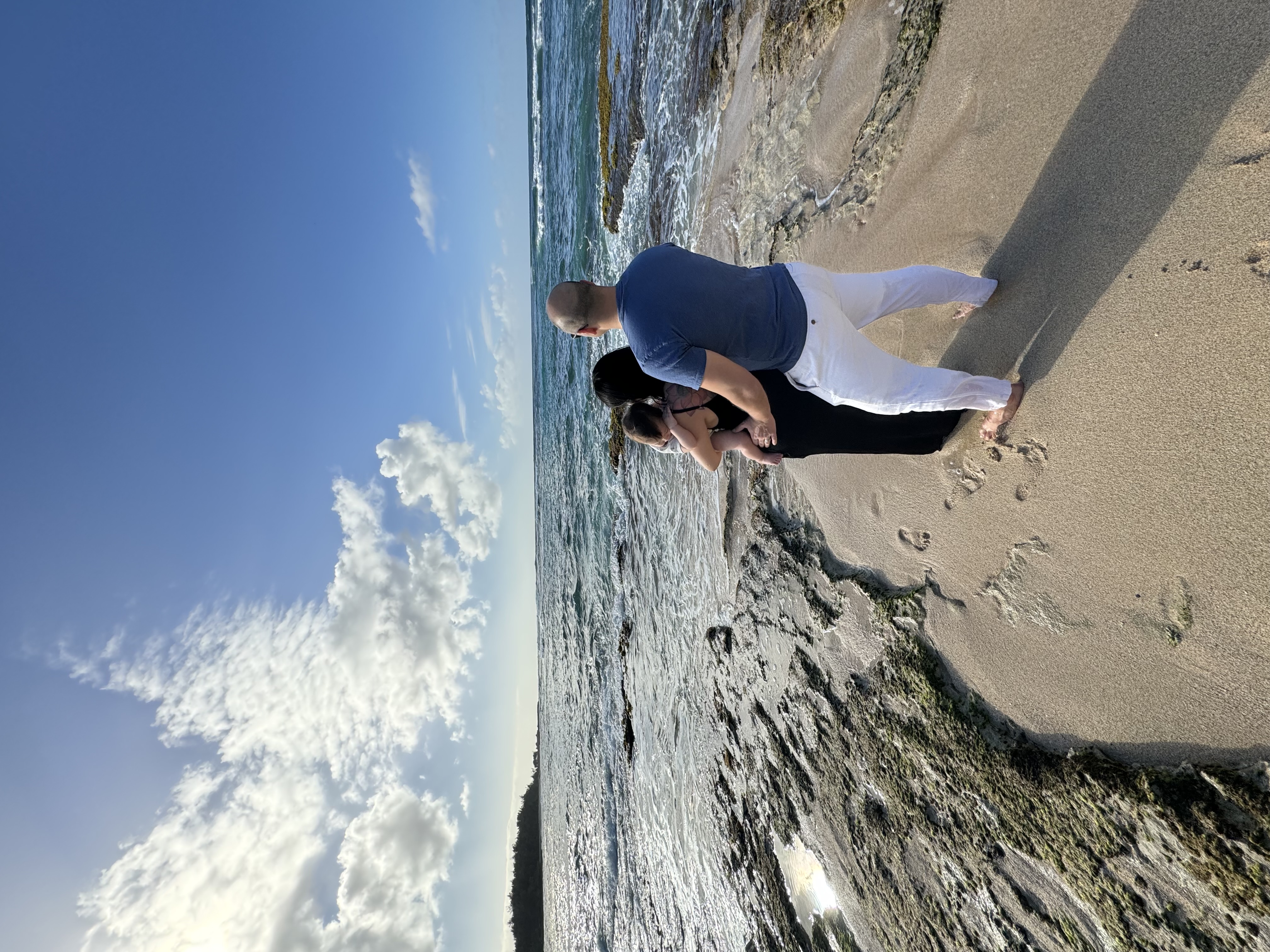 Posing for a family photo on the beach