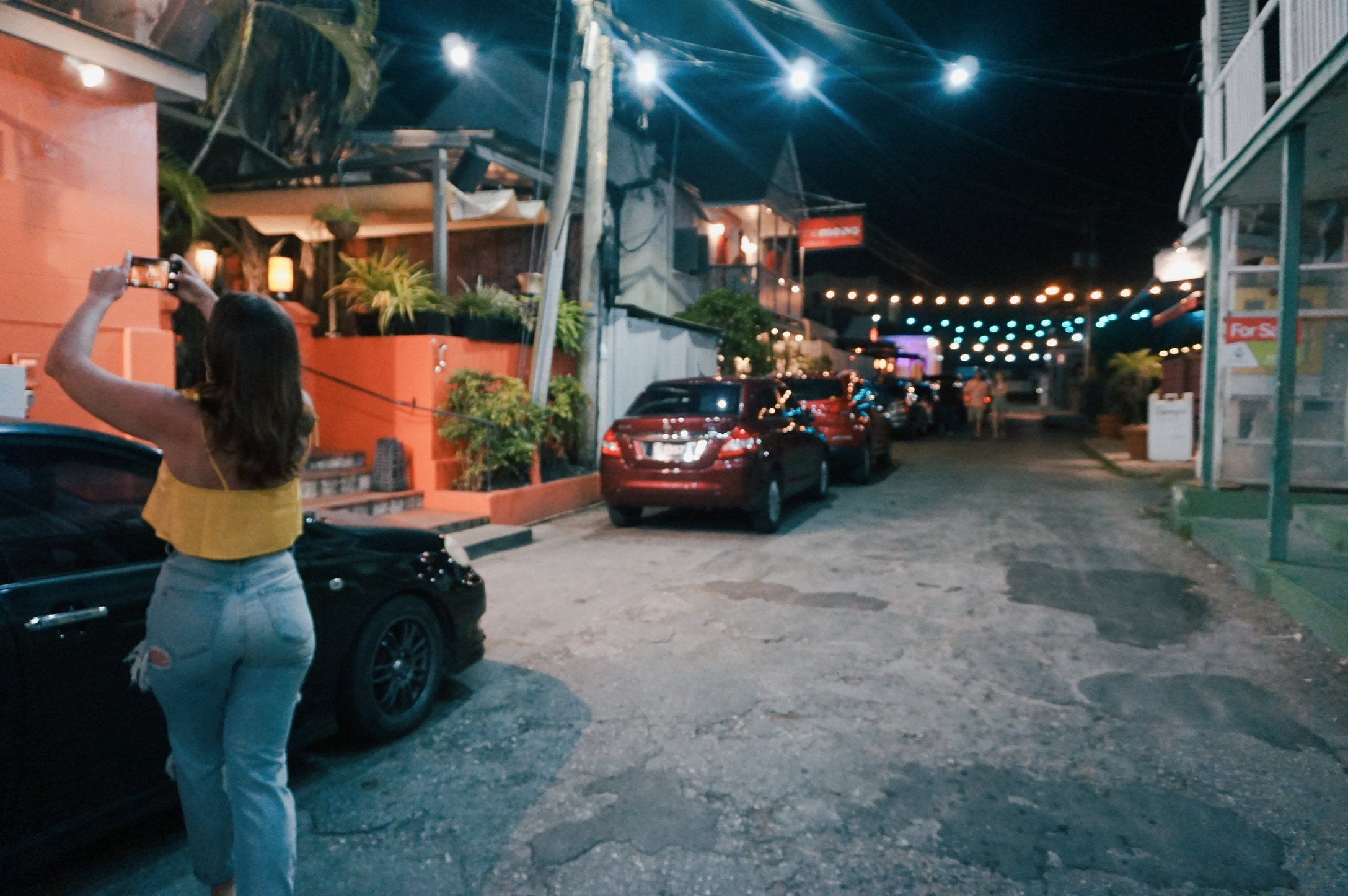 Picture of Carolyn taking photos in street