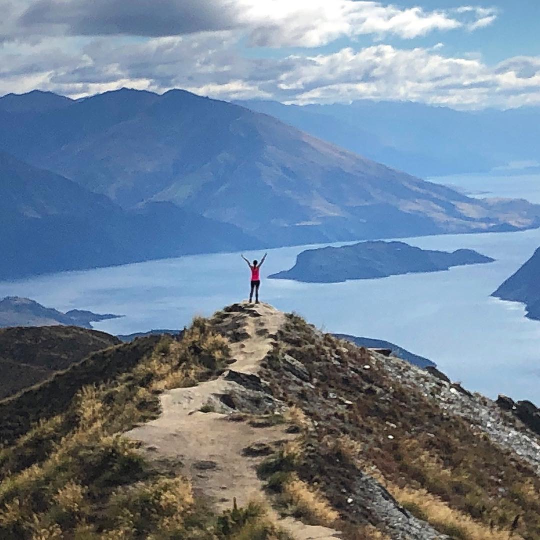 Standing on top of a mountain