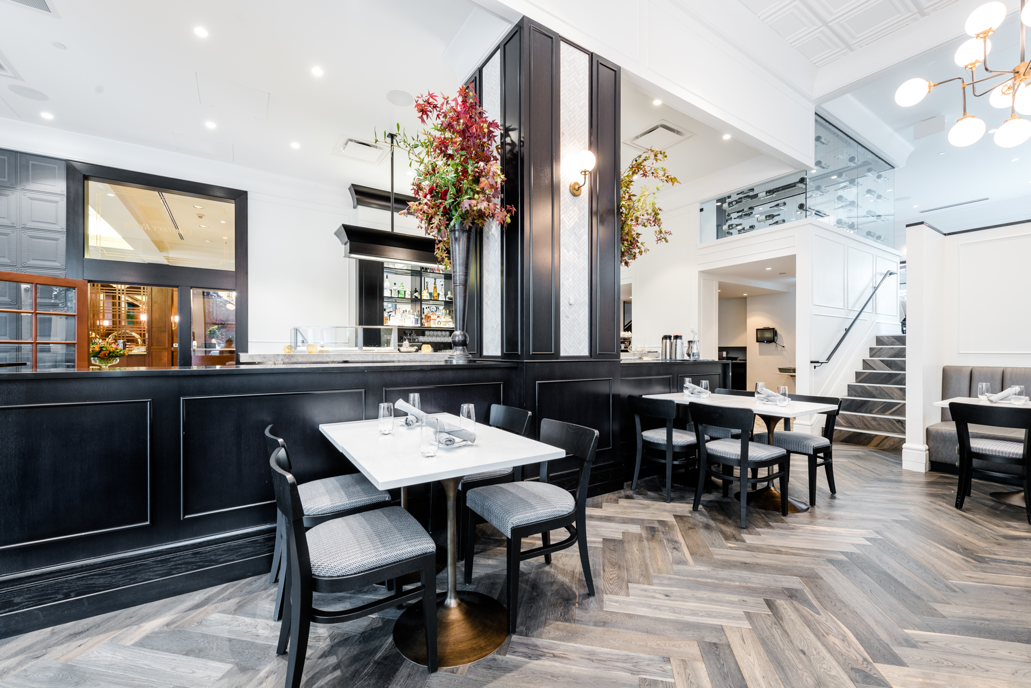 A dining area in a restaurant with wooden floors