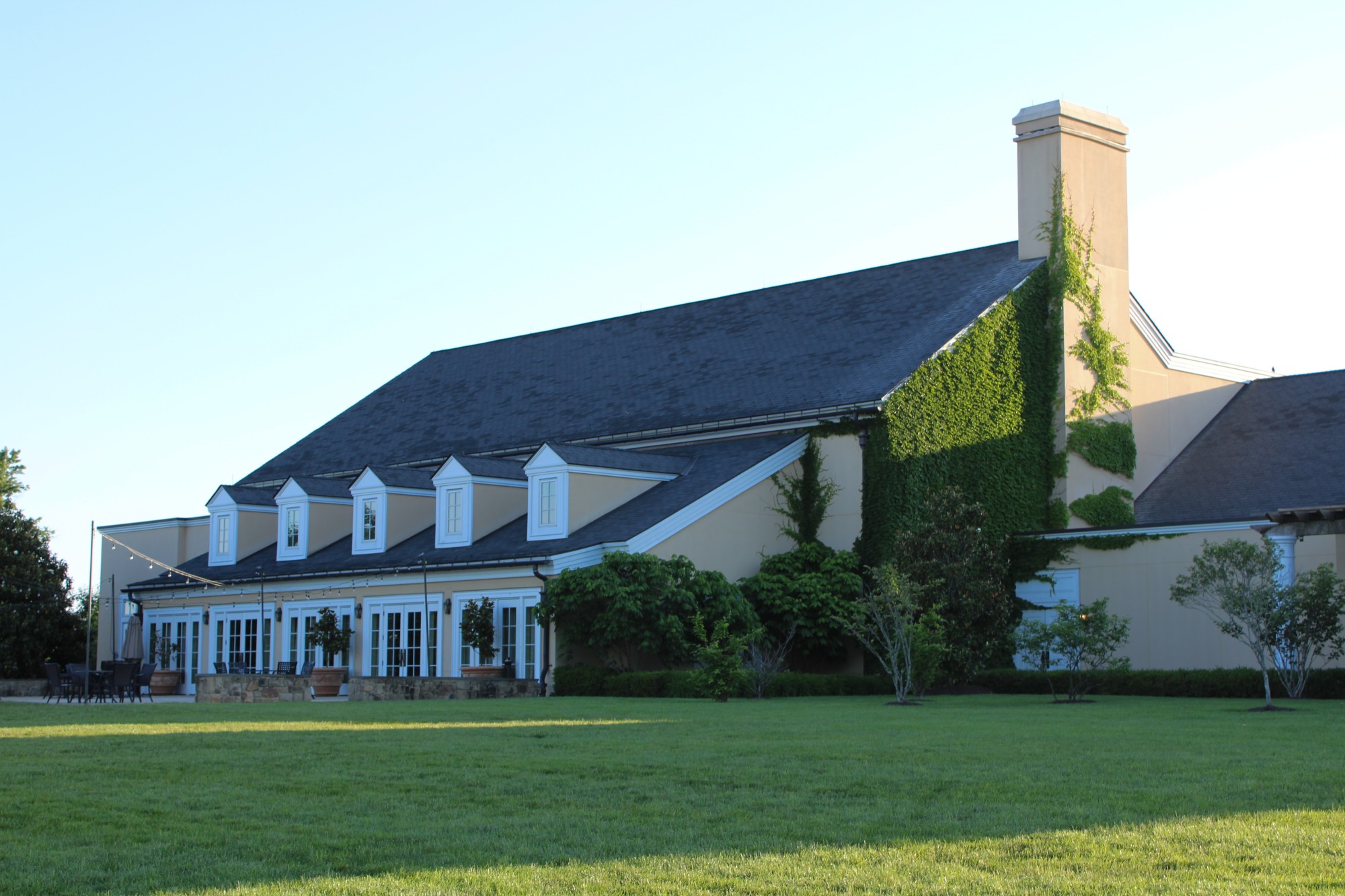 sophisticated event building on a vast green lawn