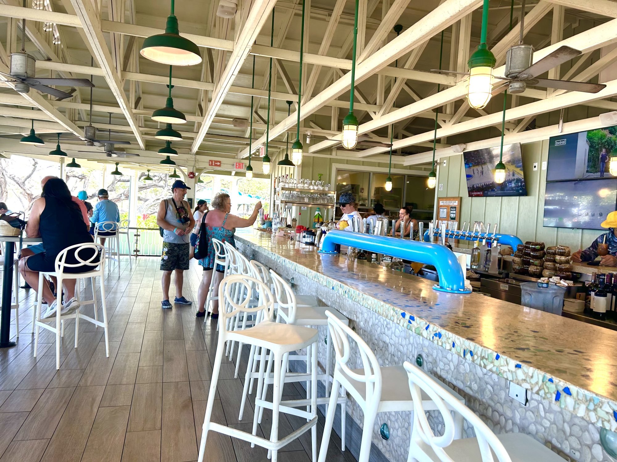 A café with bar and sitting area during day time.