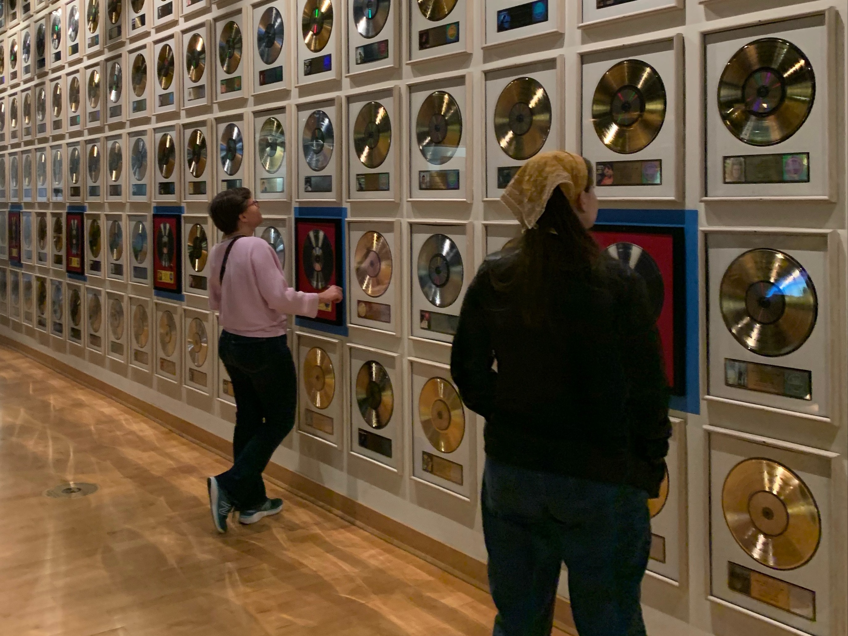 Two people looking at the Nashville country music hall of fame.