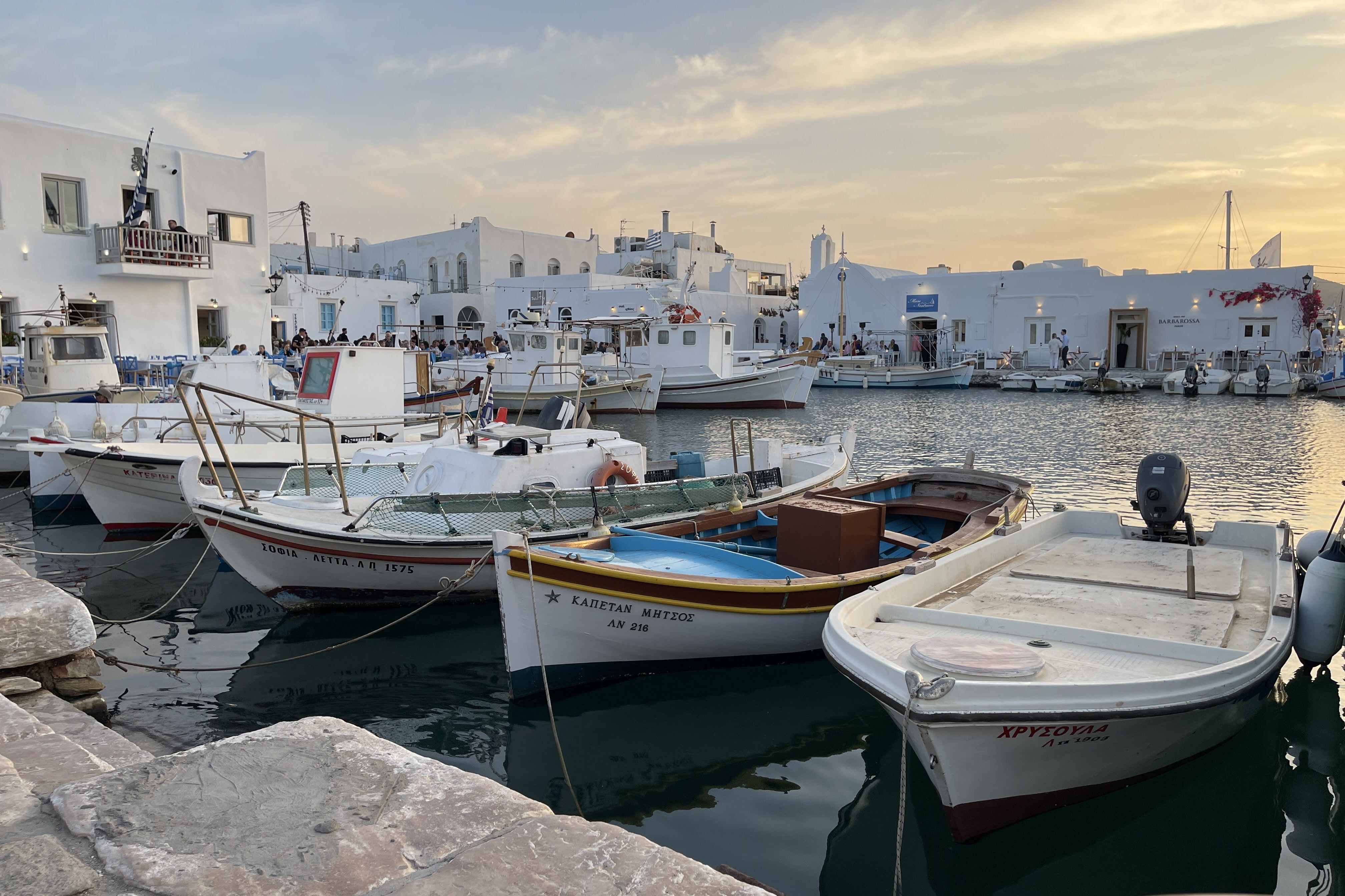 A picture of boats by the docks during the daytime.