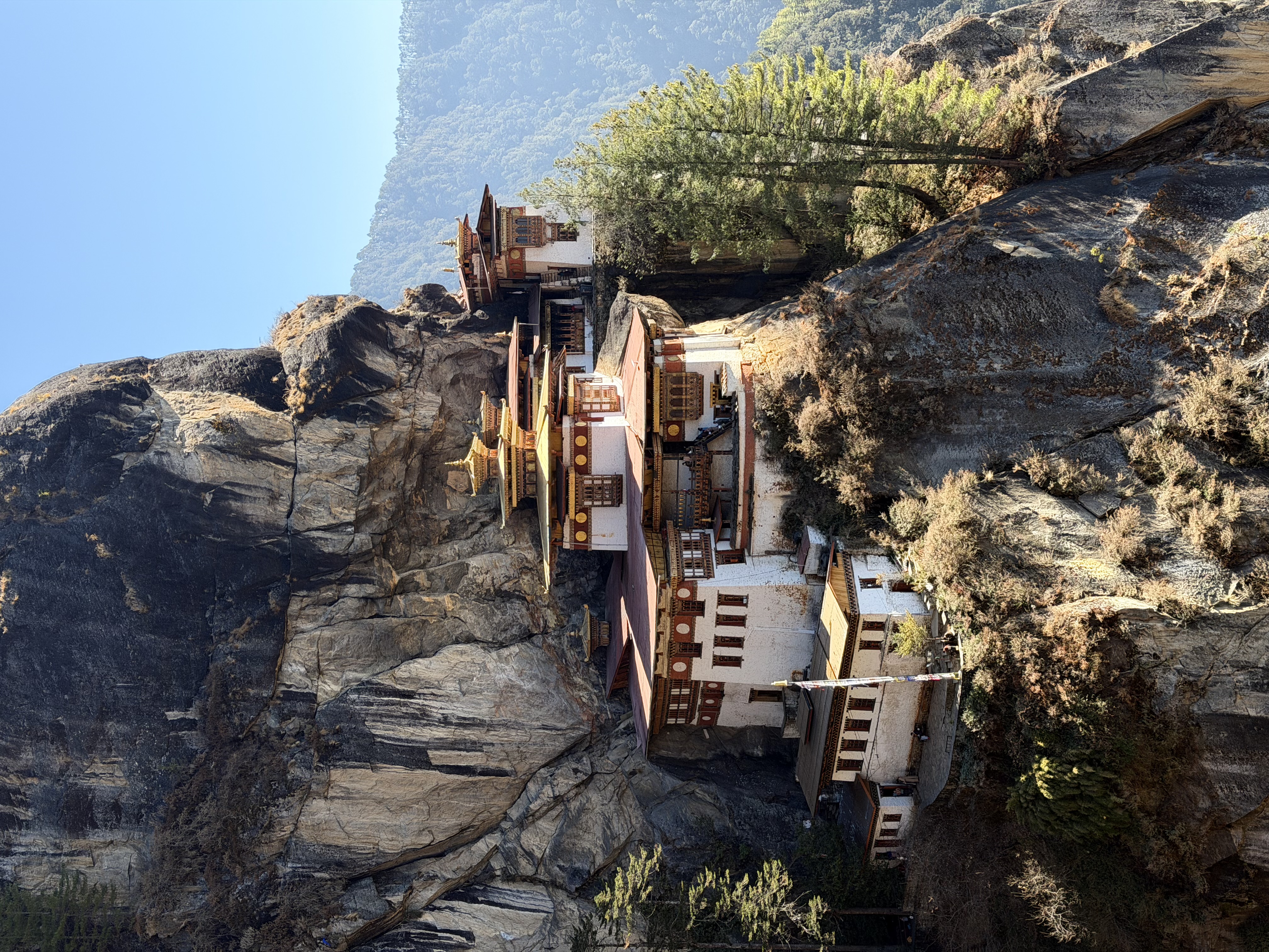 Traditional Bhutanese architecture and mountain landscapes.