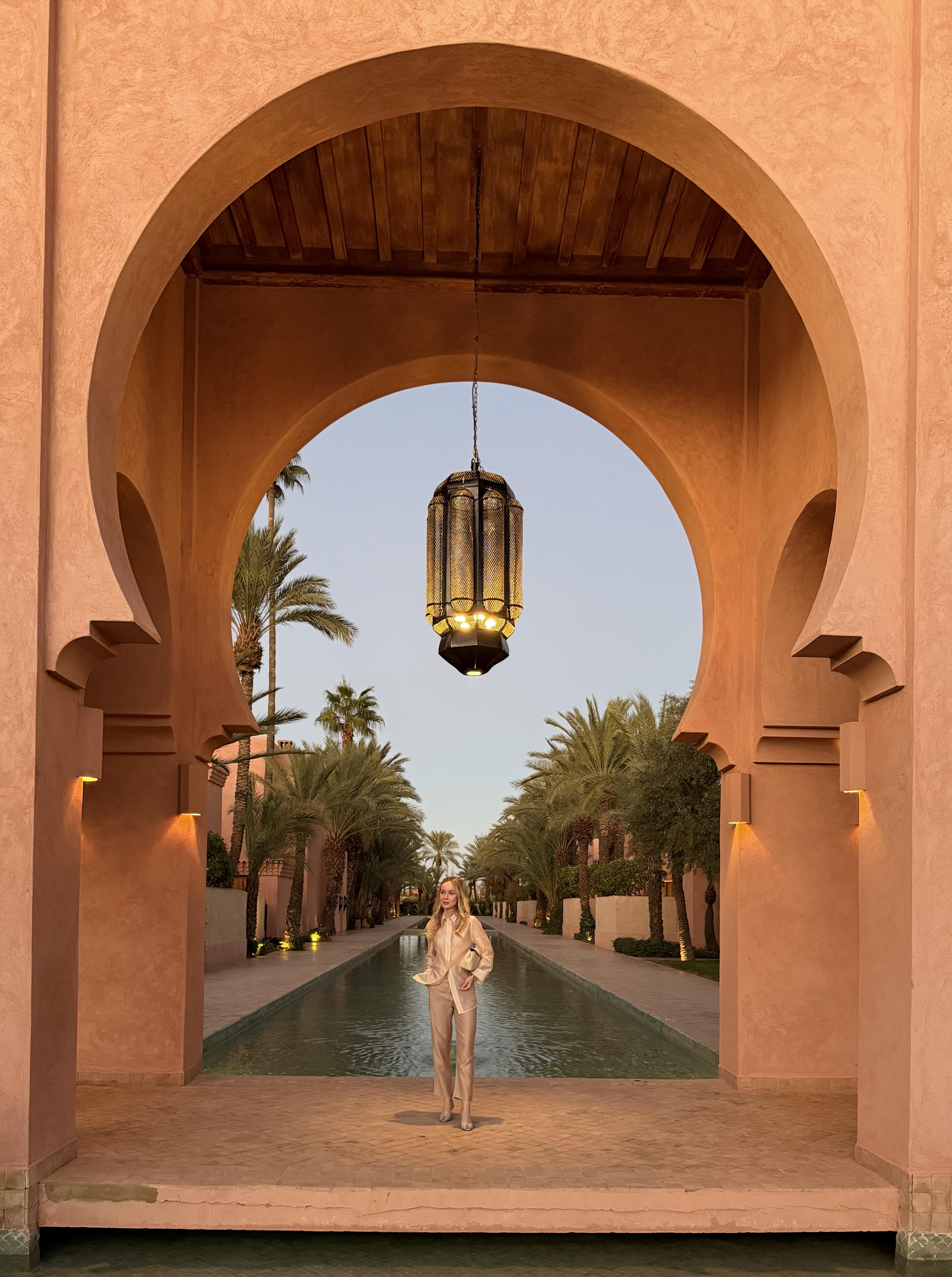 Amanjena pool reflecting the Moorish architecture of the resort.