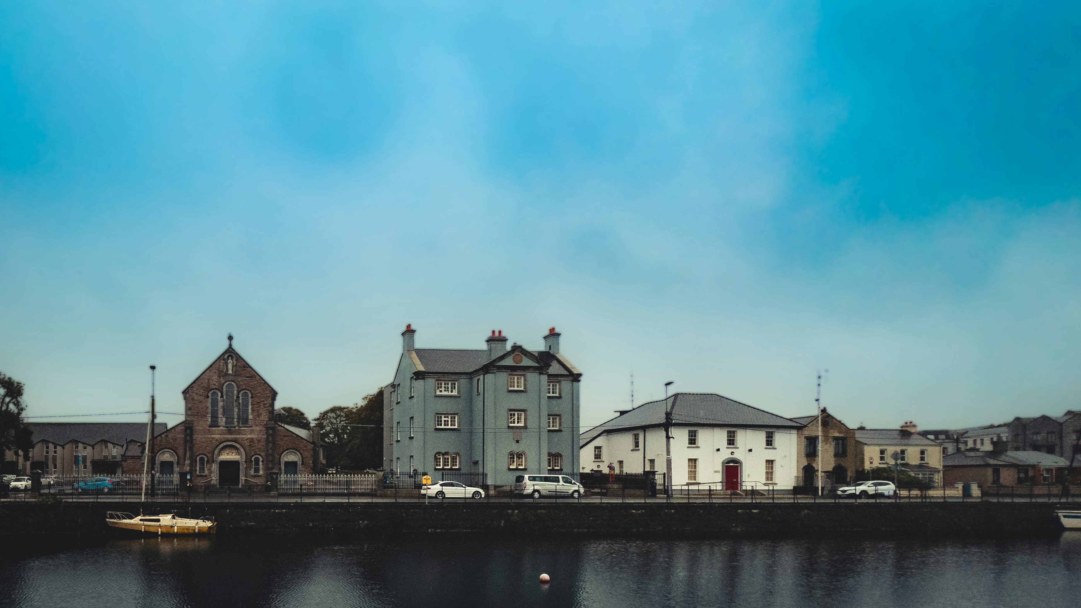buildings front water and boat daytime