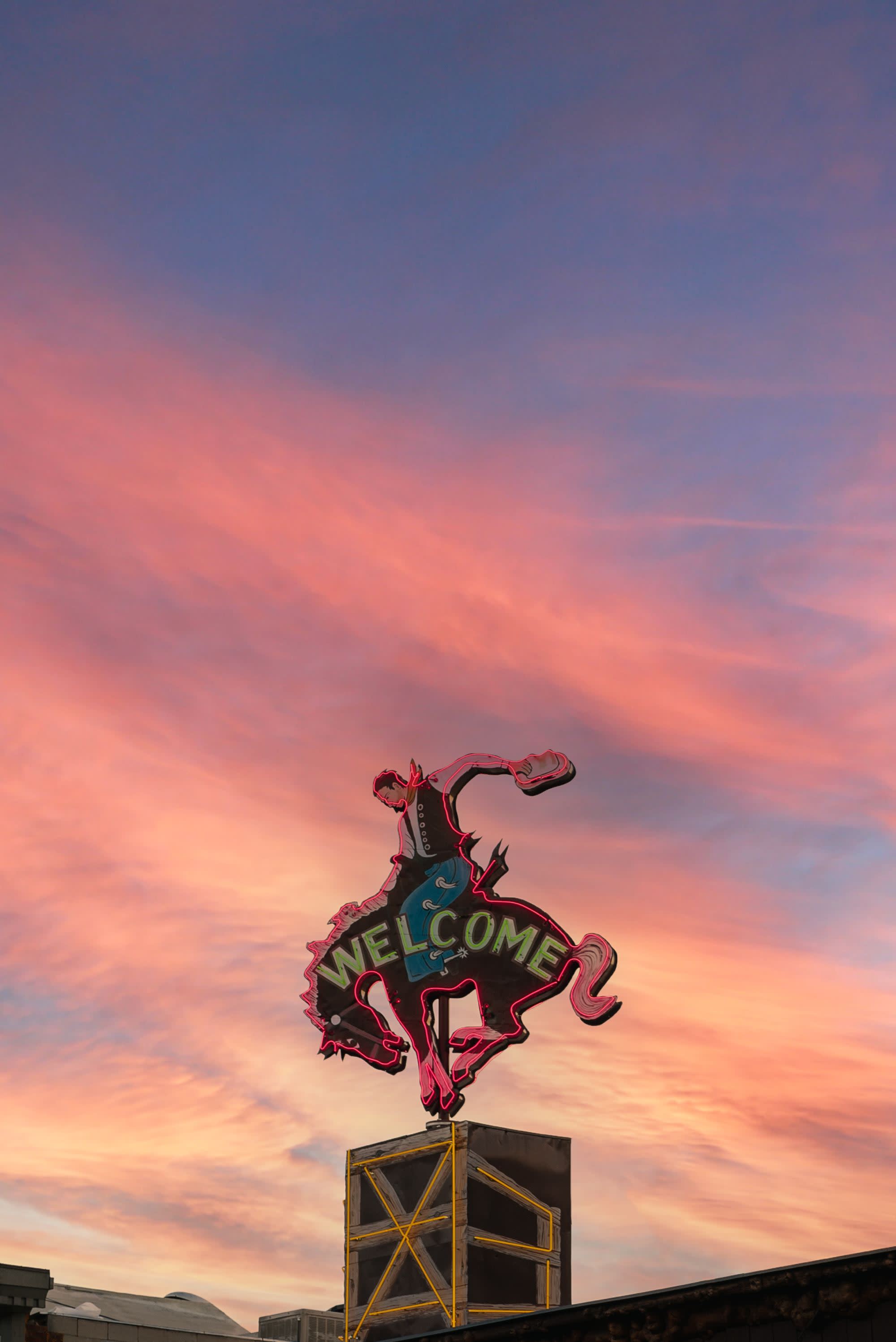 welcome sign in the shape of a cowboy riding a horse
