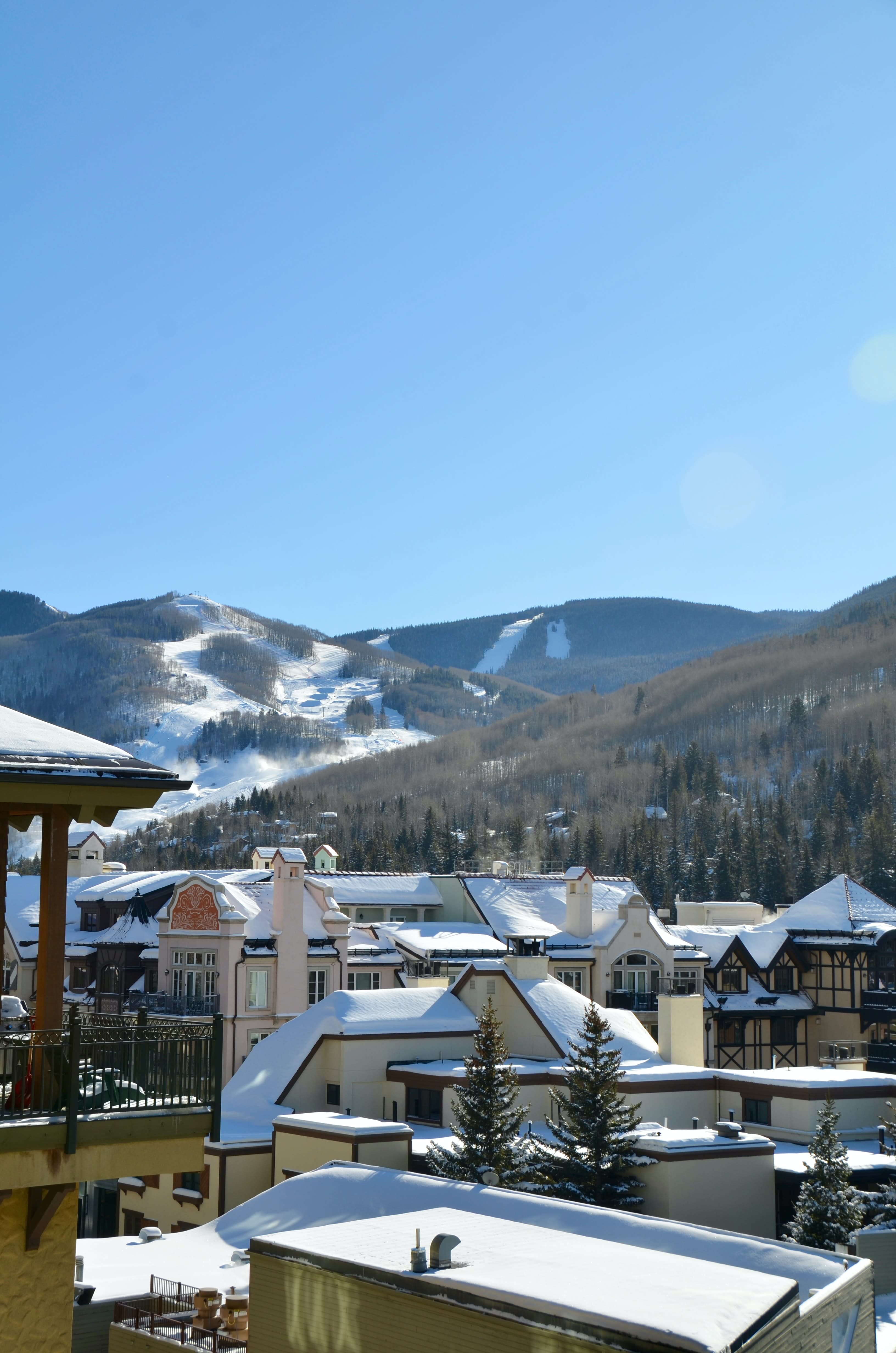 buildings with mountains in the background during daytime
