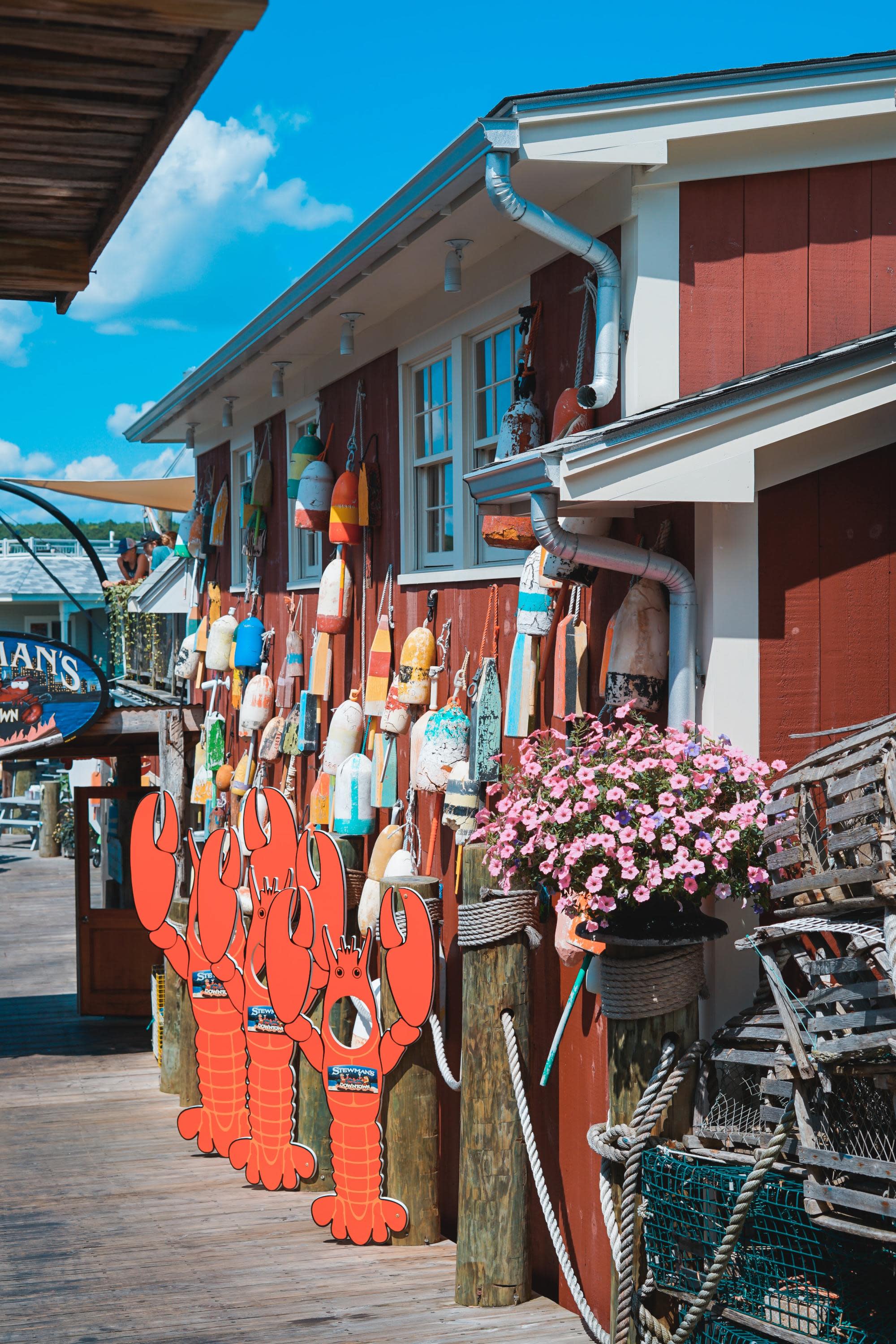 lobster shack with buoys hanging on the exterior