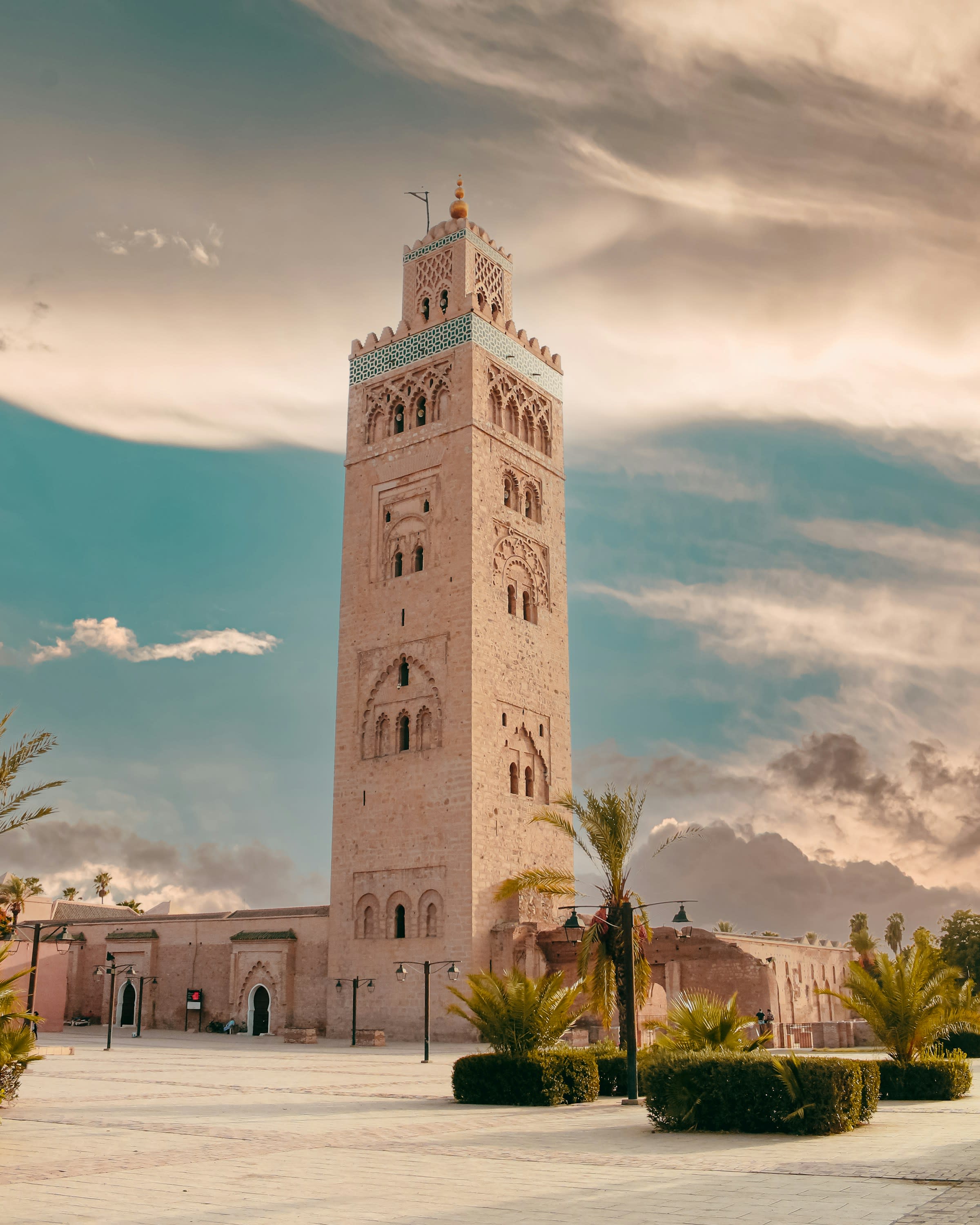 A 12th-century landmark against a blue sky with clouds.