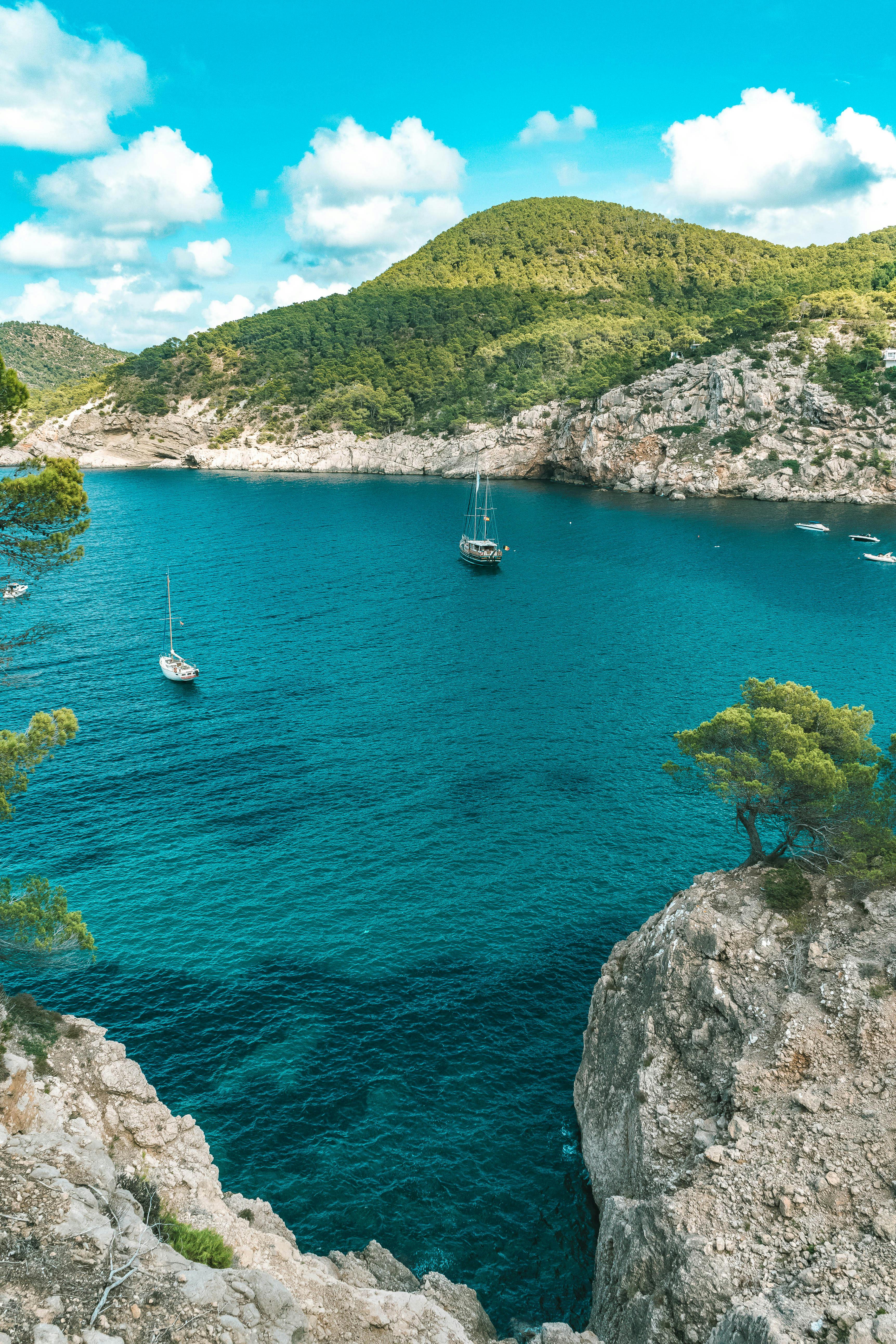 A body of water between rocky cliff sides during the daytime