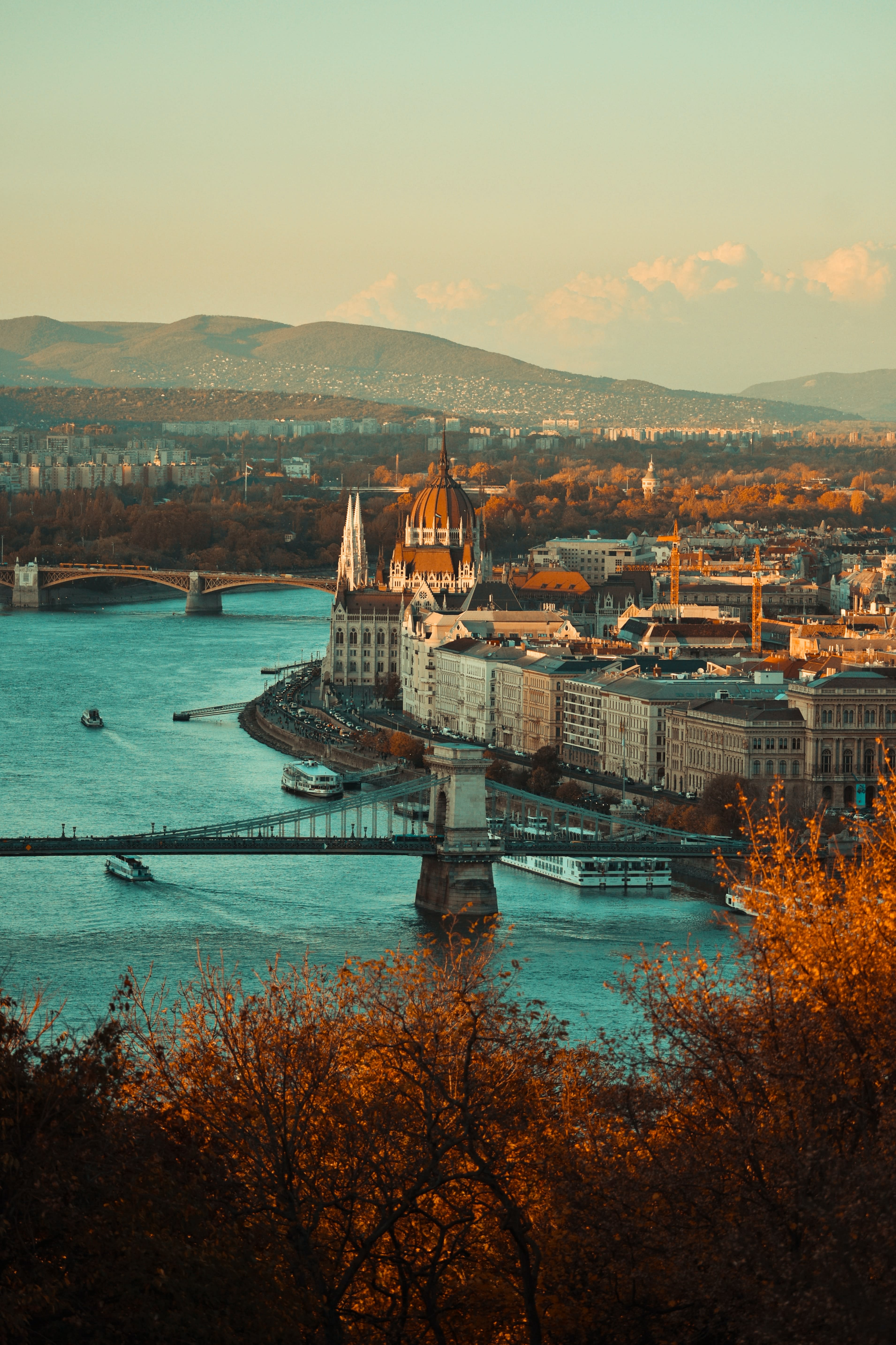 large city next to body of water during sunset