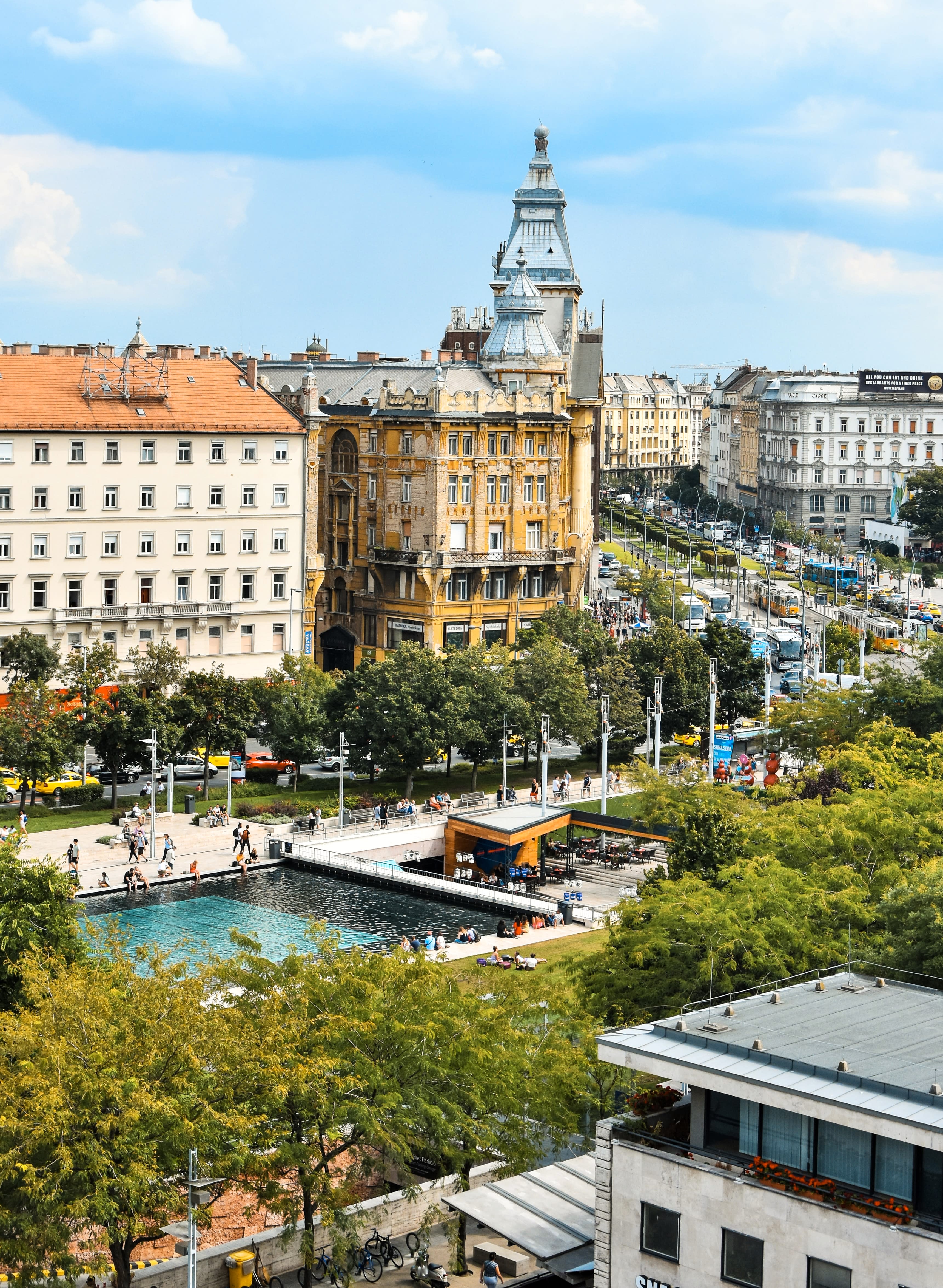 large buildings next to a pool (great activity when in Budapest with kids) during daytime