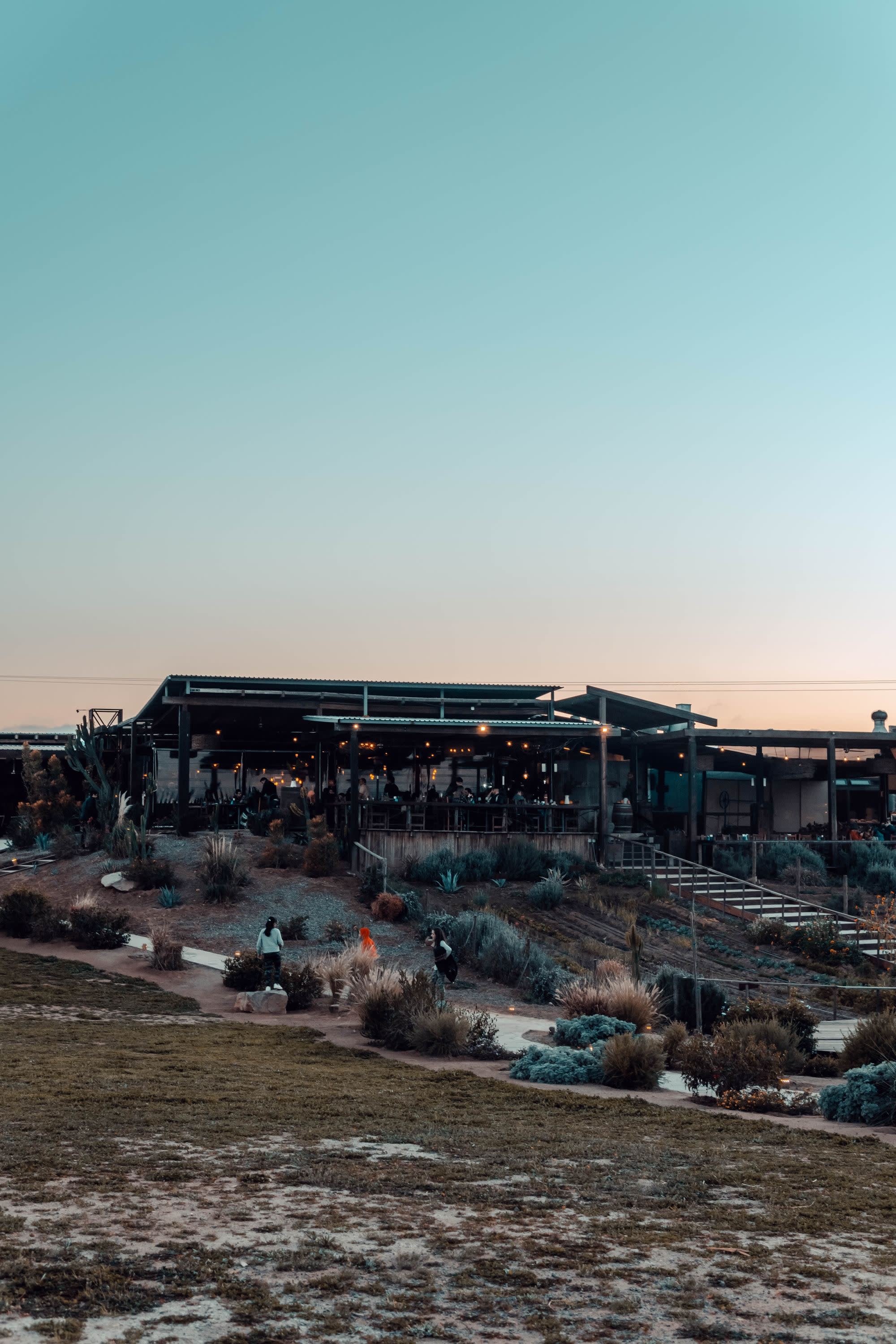 indoor outdoor restaurant at sunset in the desert