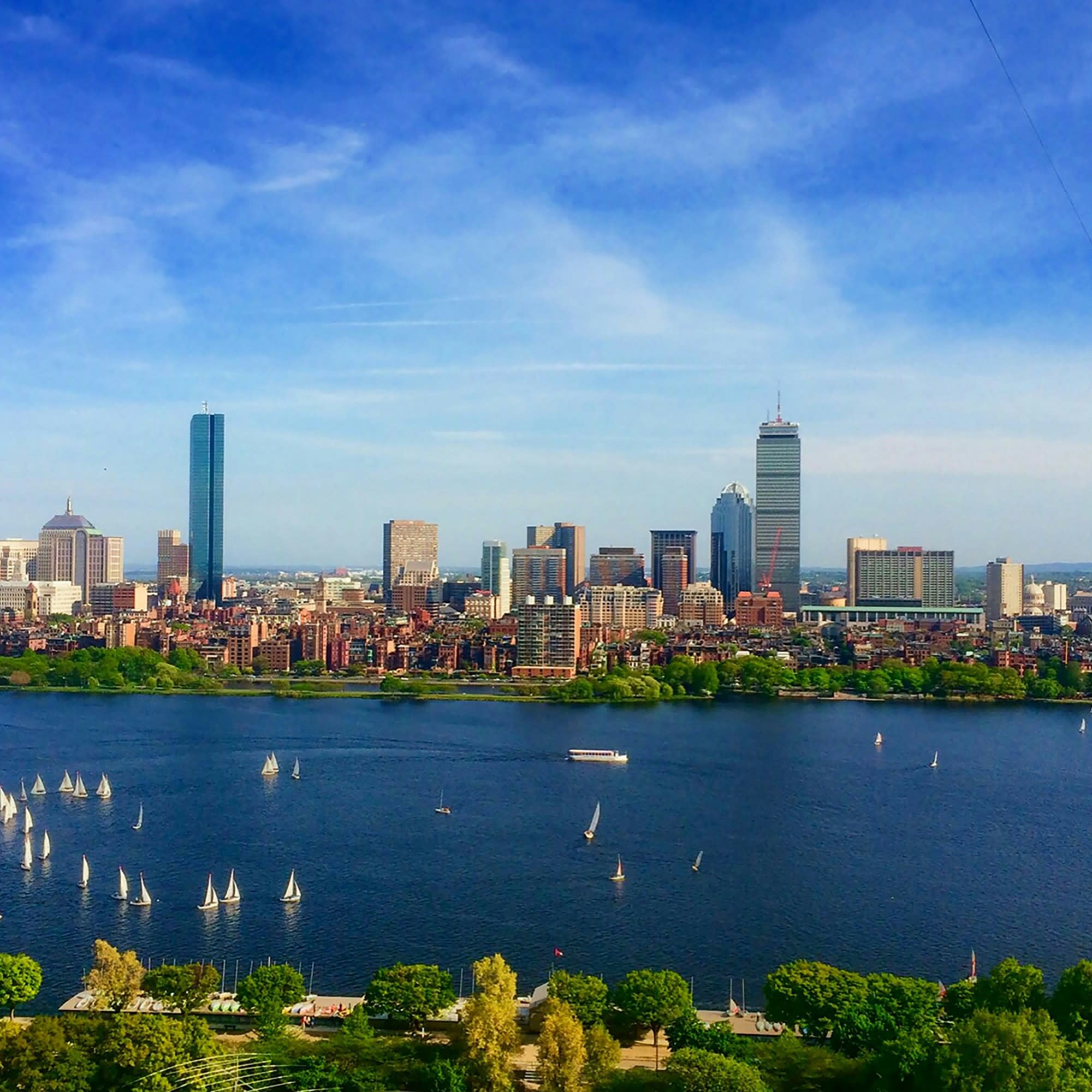 A view of a city skyline with a body of water in front of it