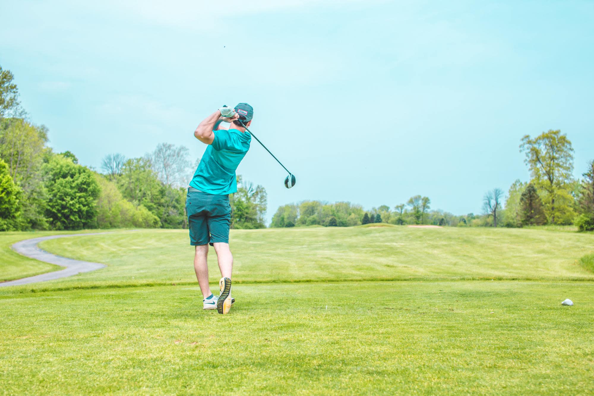 man swinging a golf club
