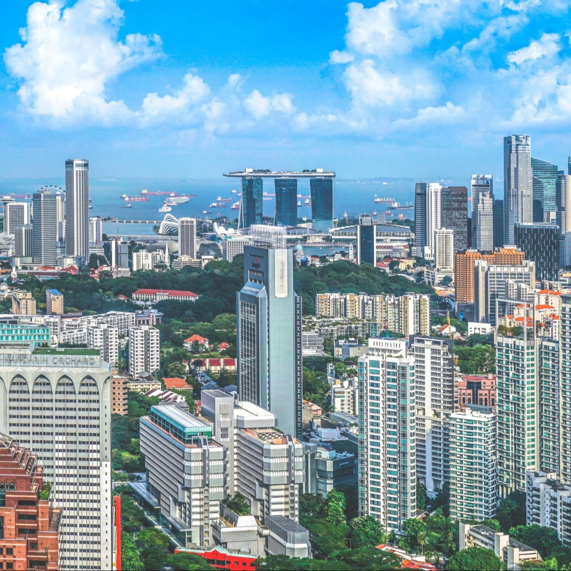 An aerial view of the city with tall buildings during daytime.