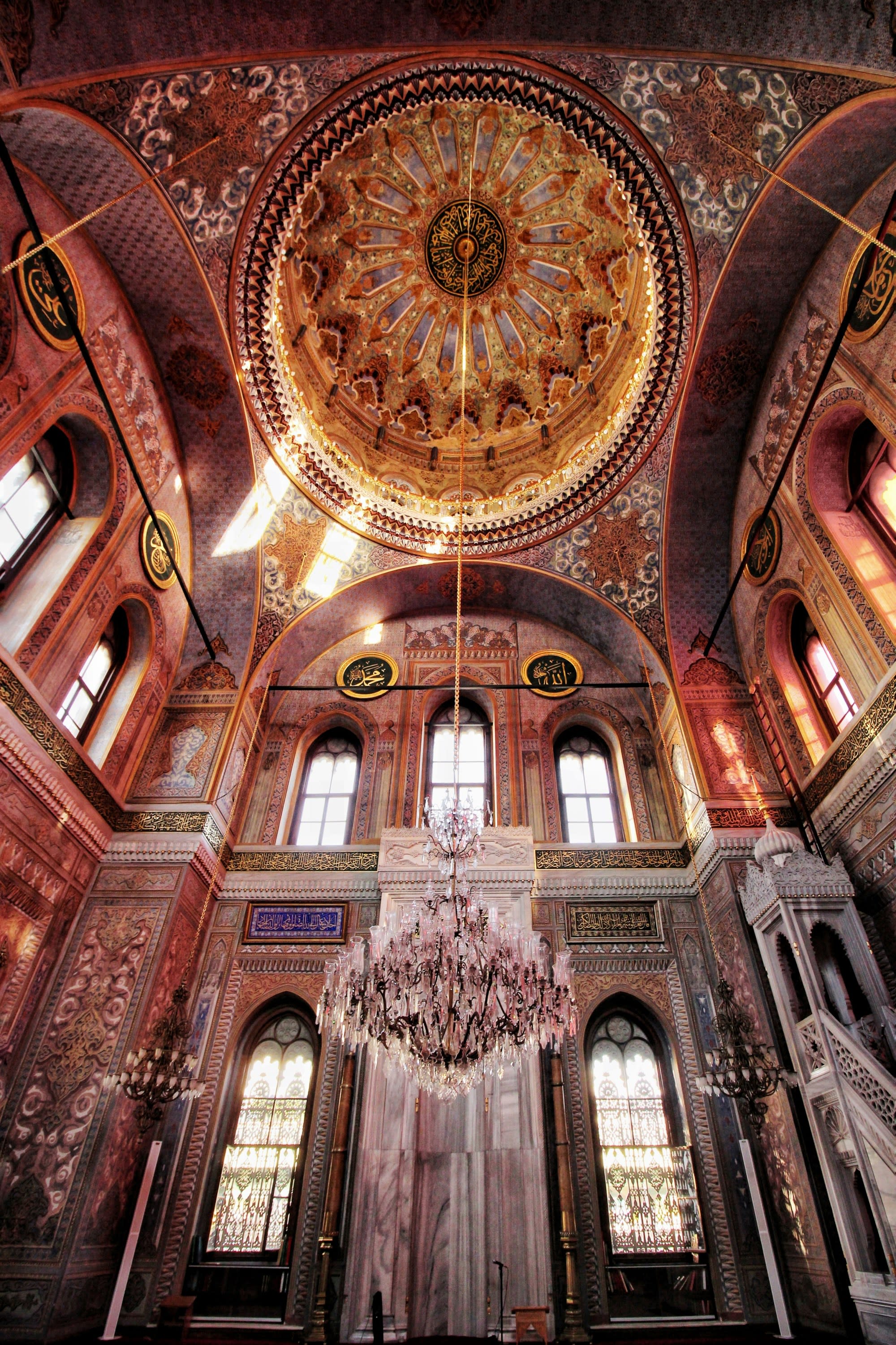 A low angled picture of a building's dome during the daytime.